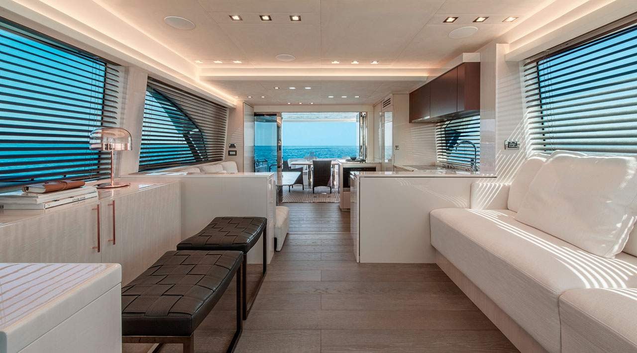 a room with a couch and a table and a window aboard GRACE Yacht for Sale