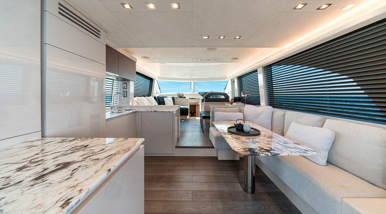 a room with a couch and a table and a pool aboard GRACE Yacht for Sale