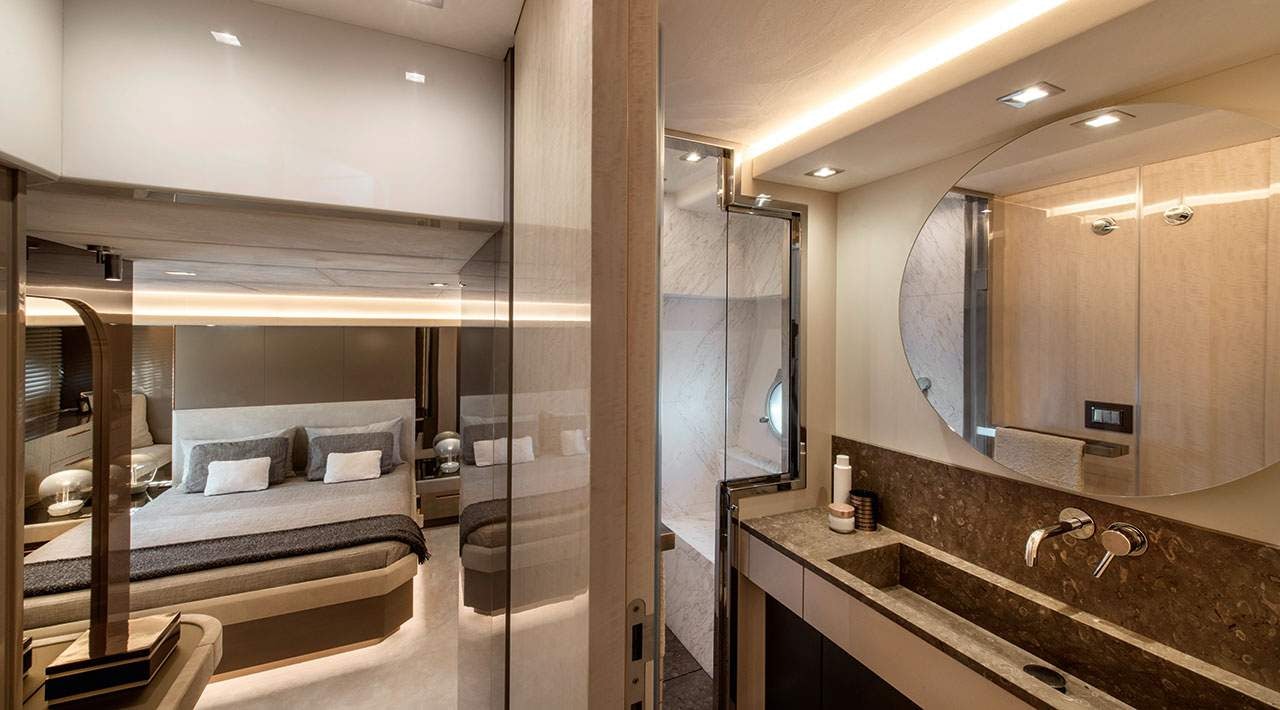 a bathroom with a bed and a bathtub aboard GRACE Yacht for Sale