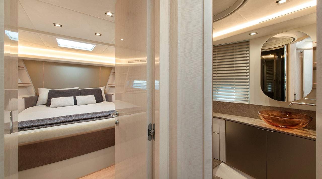 a bathroom with a sink and a bed aboard GRACE Yacht for Sale