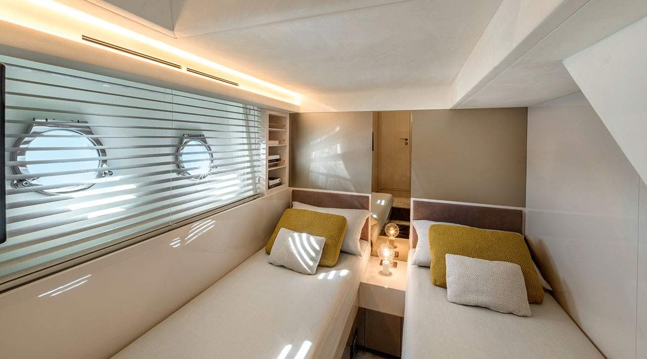 a room with a bed and a window aboard GRACE Yacht for Sale