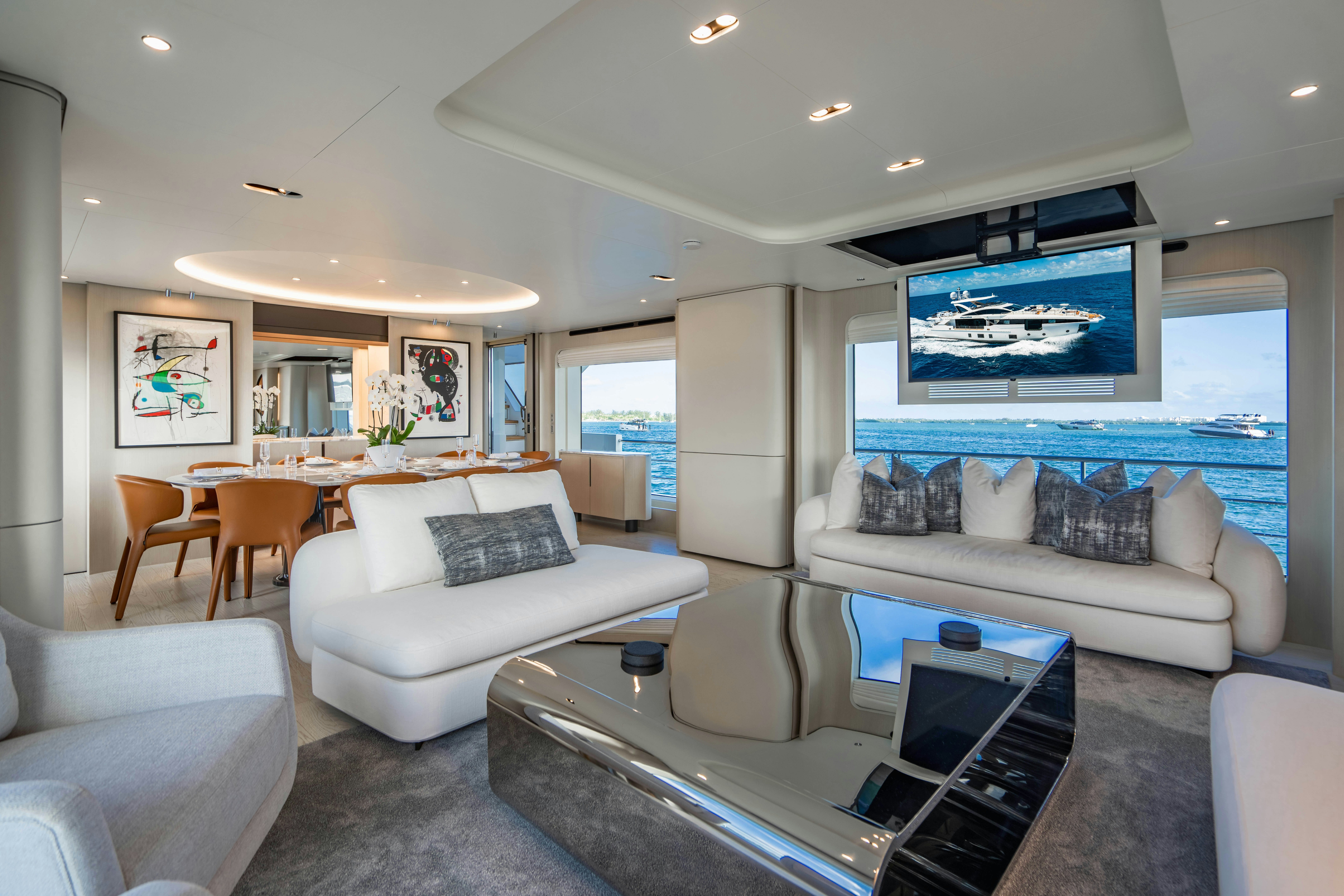 a living room with a large screen aboard CARPE DIEM Yacht for Charter