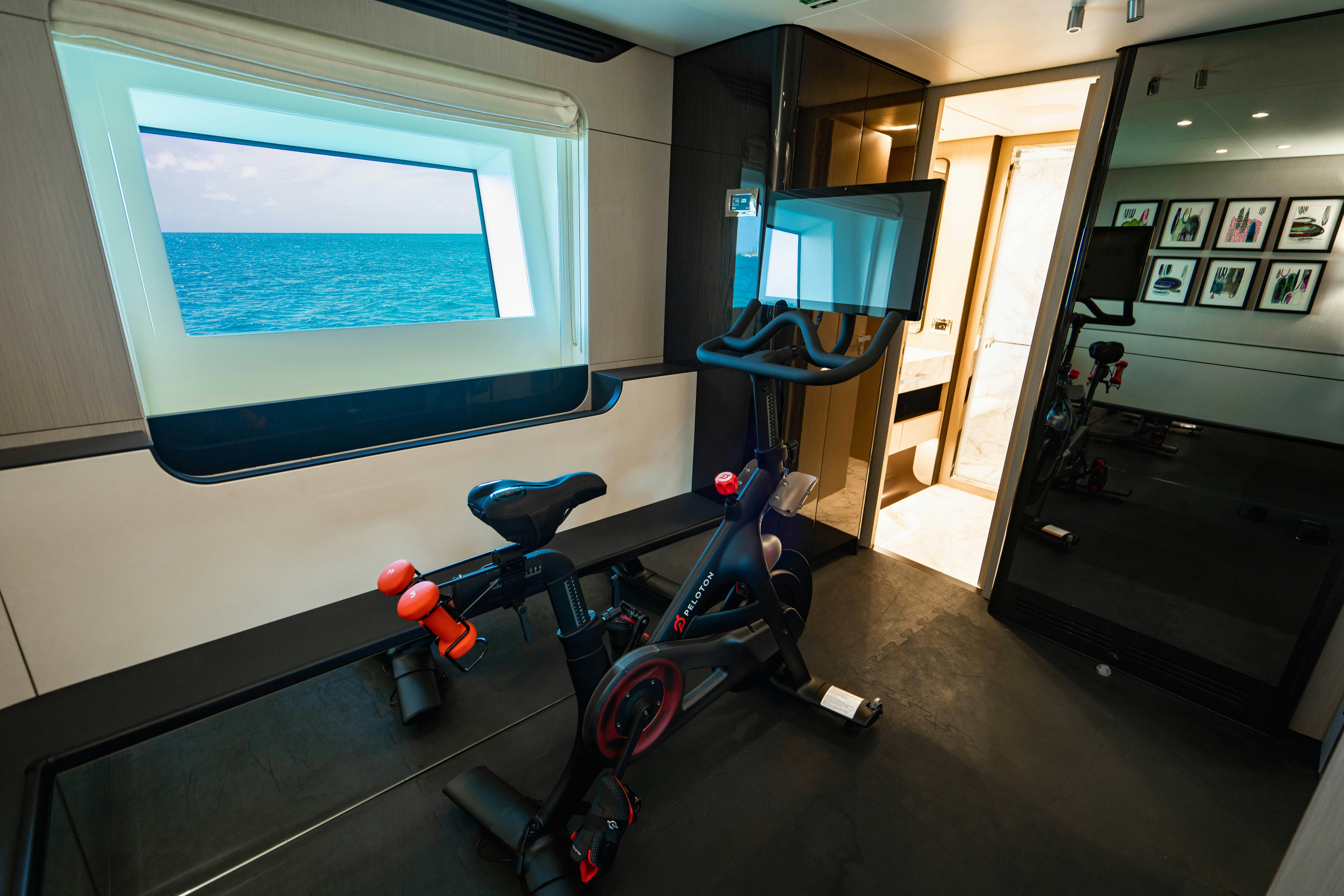 a room with exercise equipment aboard CARPE DIEM Yacht for Charter