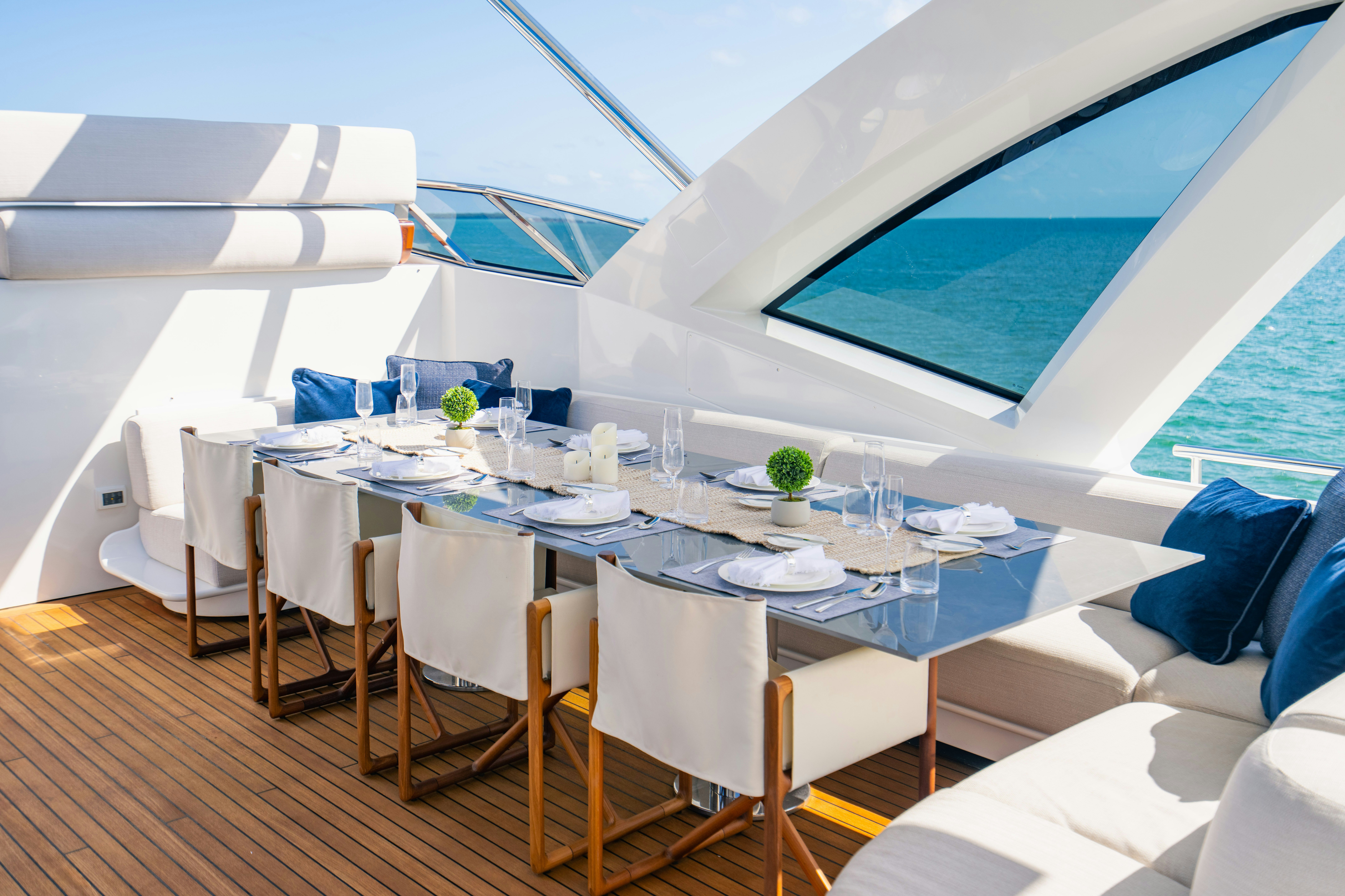 a table with chairs and a large umbrella aboard CARPE DIEM Yacht for Charter