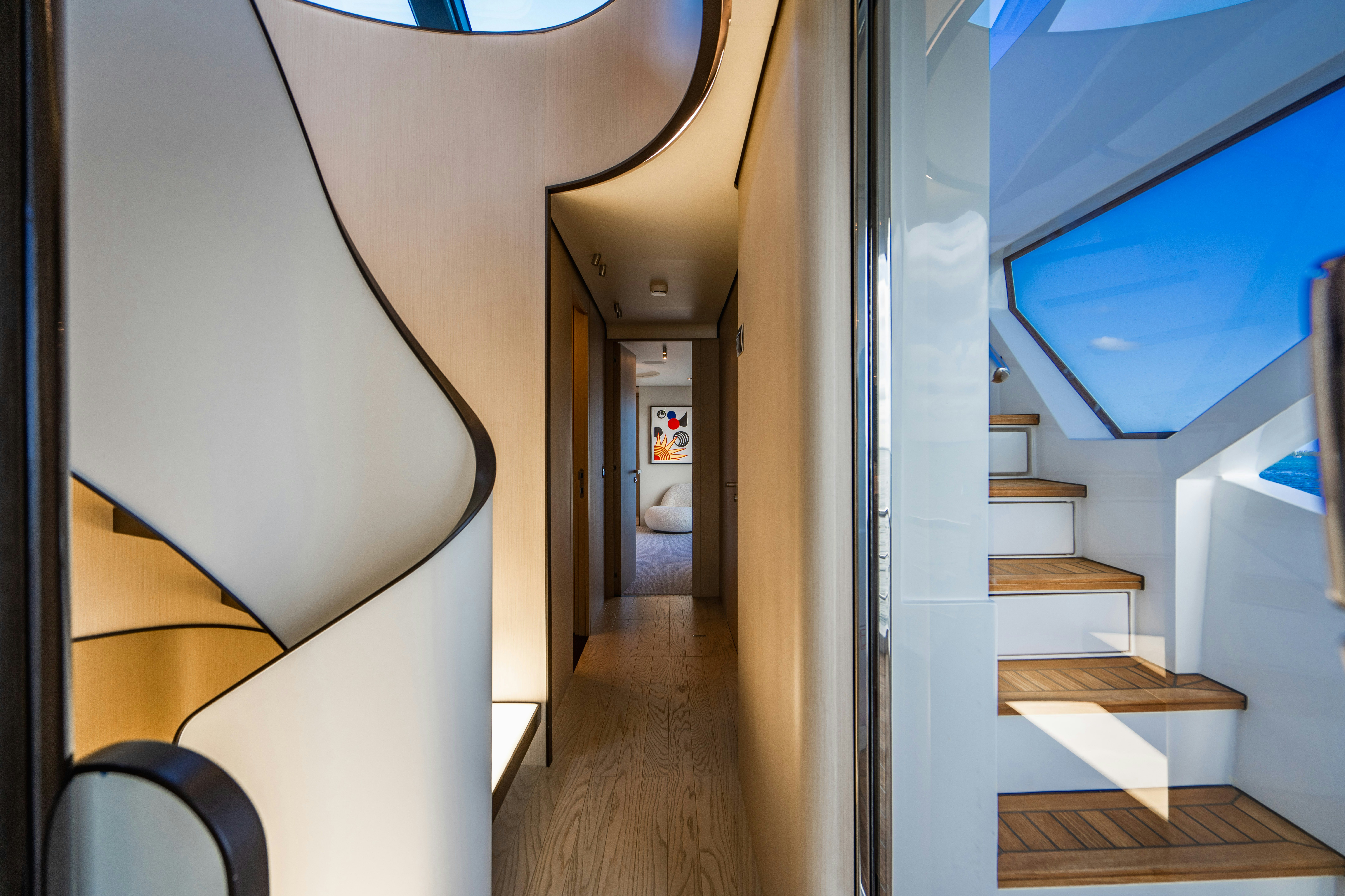 a hallway with a white wall and a wood floor aboard CARPE DIEM Yacht for Charter