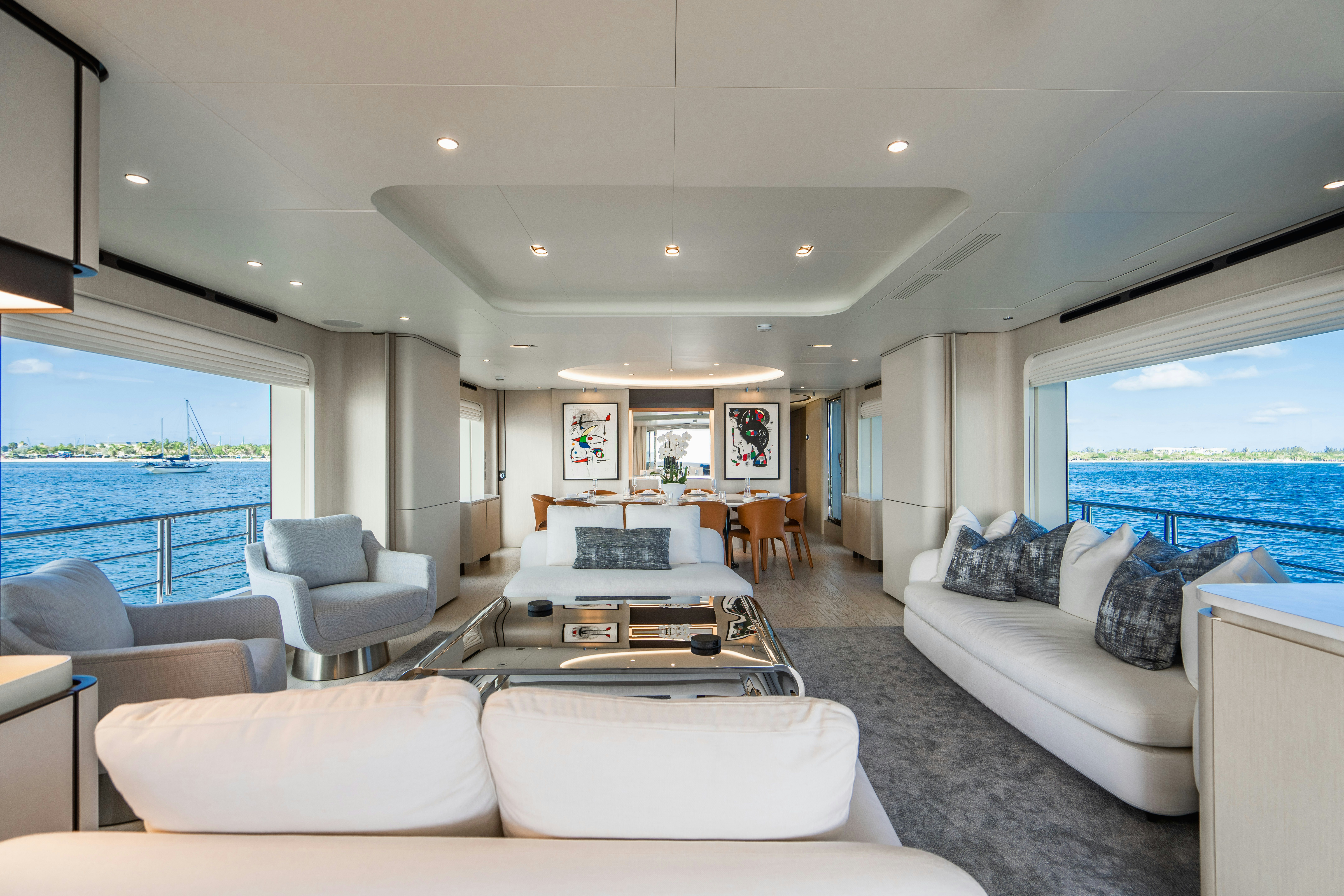 a living room with a large window aboard CARPE DIEM Yacht for Charter