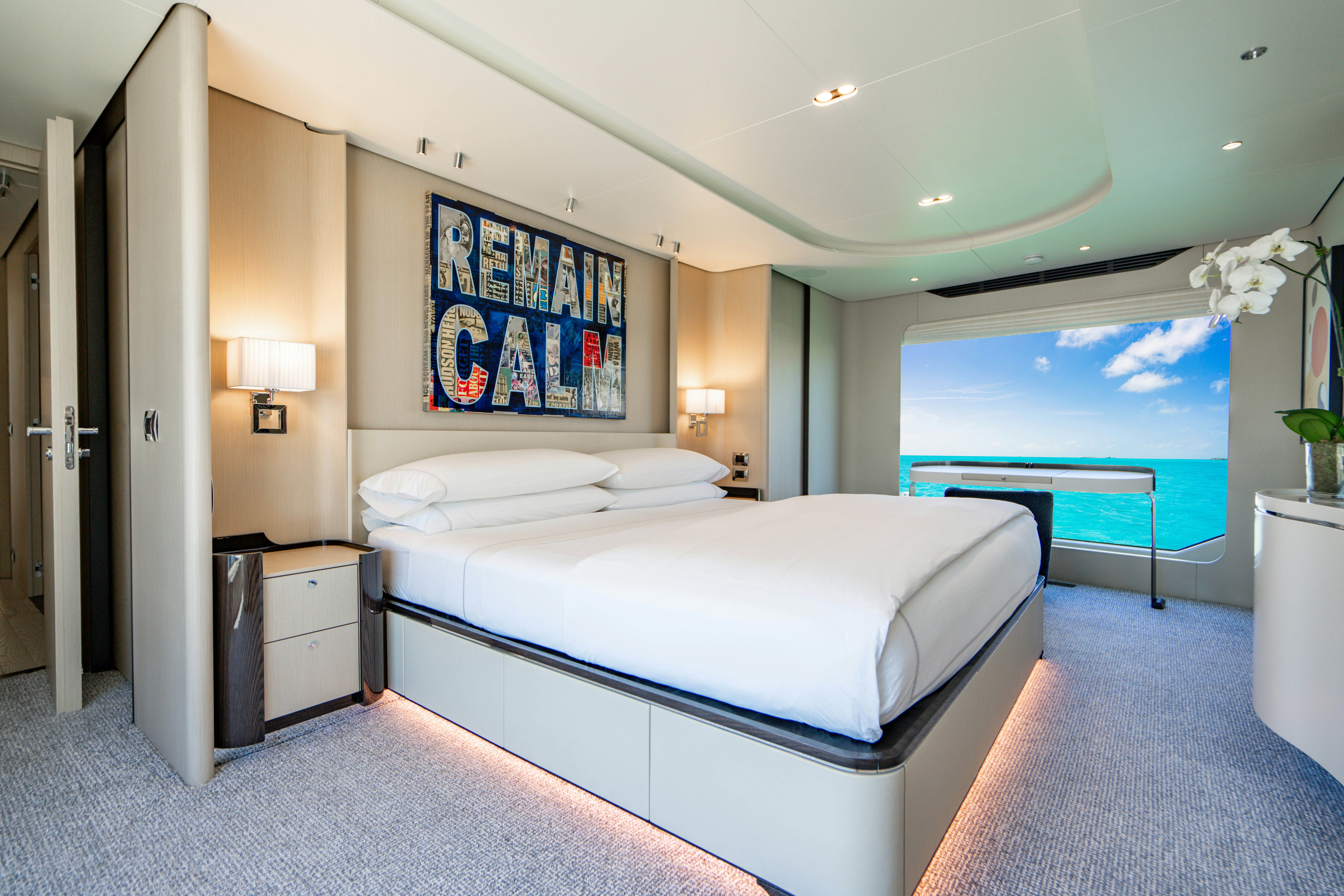 a room with a bed and a pool aboard CARPE DIEM Yacht for Charter