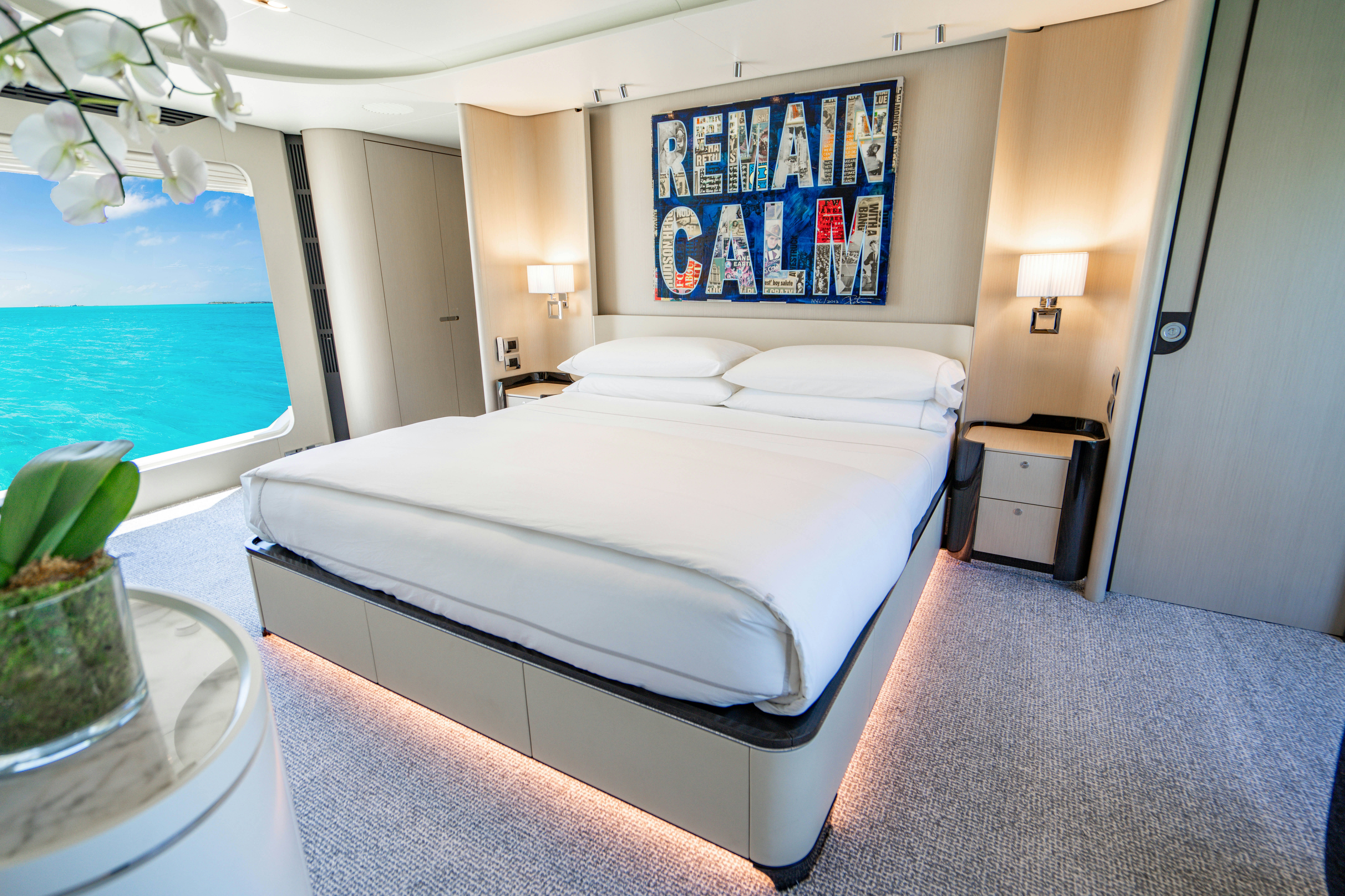 a bed with white sheets aboard CARPE DIEM Yacht for Charter