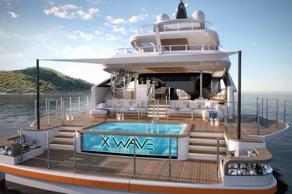 a large cruise ship docked aboard XWAVE Yacht for Charter