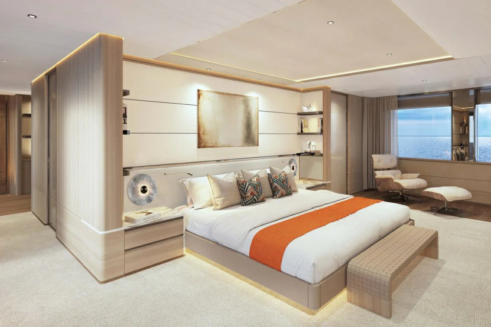 a room with a bed and a large mirror aboard XWAVE Yacht for Charter