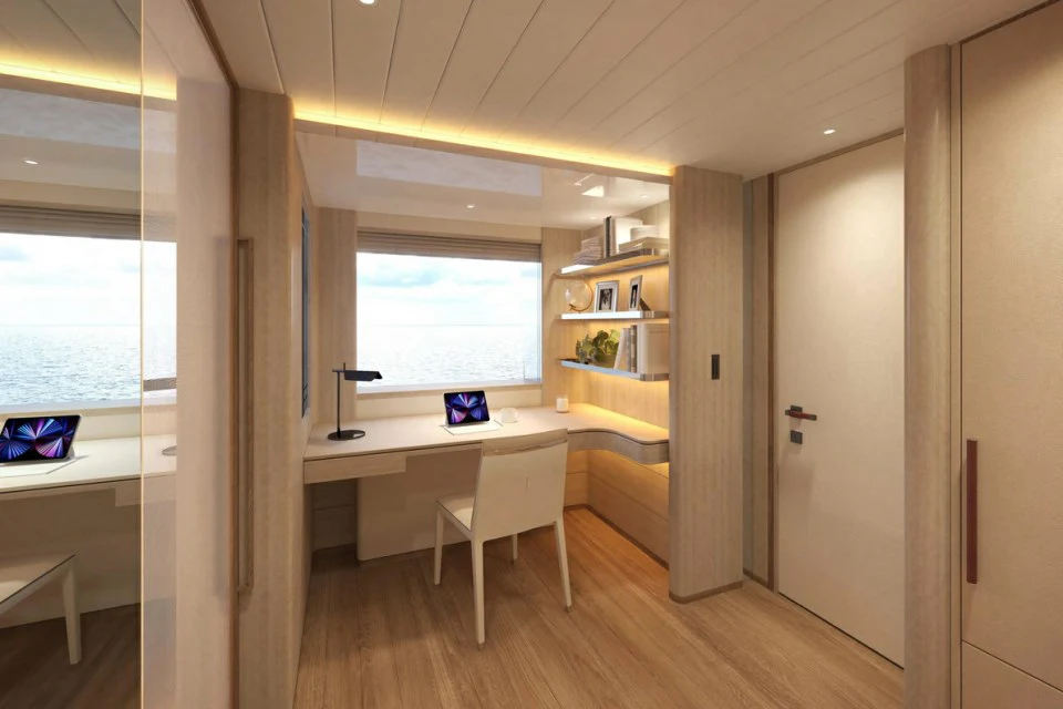 a room with a desk and a window aboard XWAVE Yacht for Charter