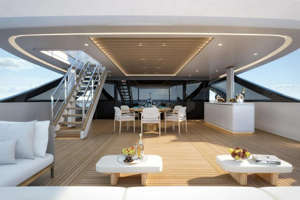 a room with a table and chairs aboard XWAVE Yacht for Charter