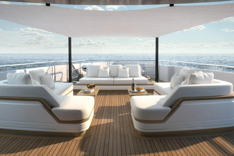 a large living room with a large body of water aboard XWAVE Yacht for Charter