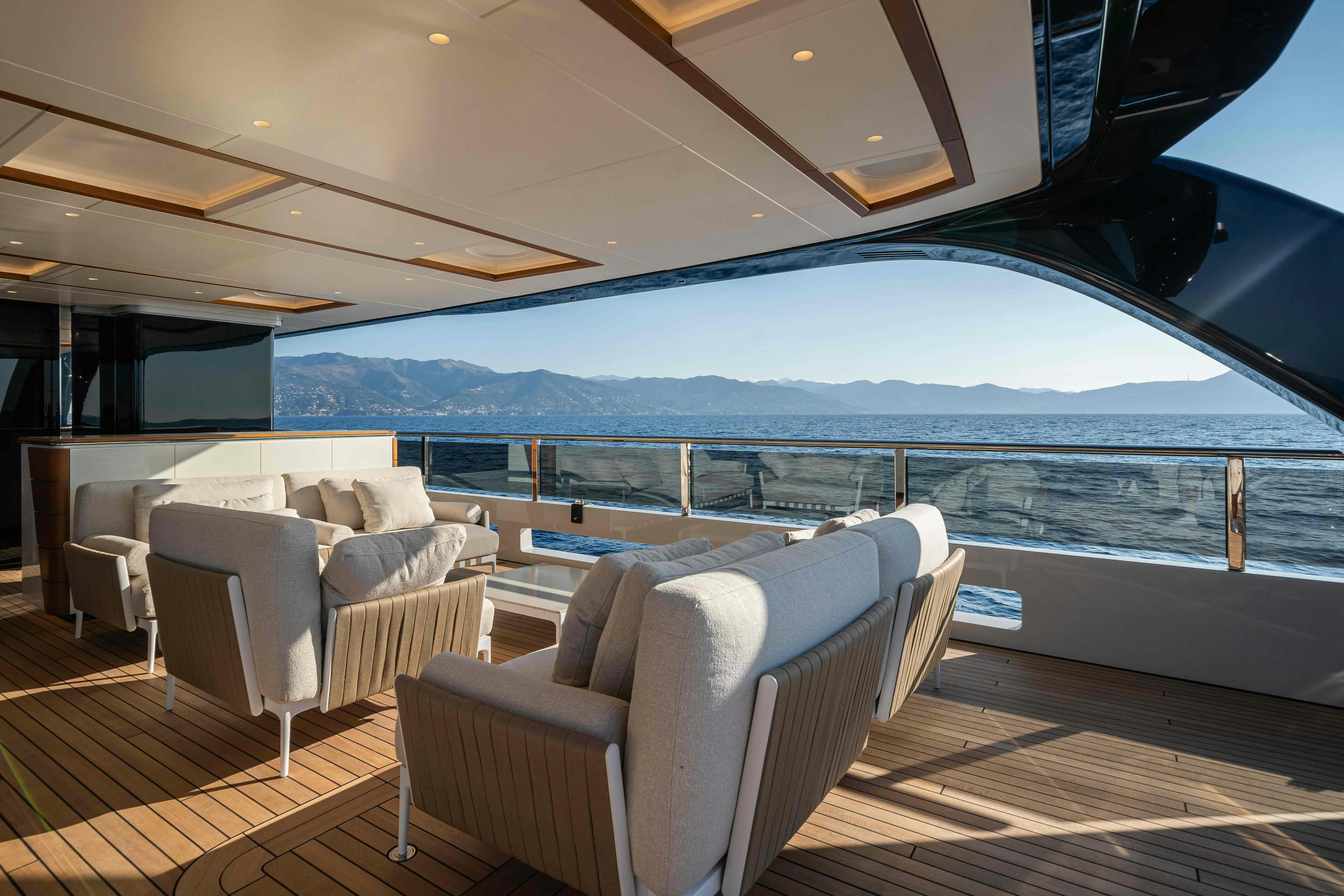 a large living room with a large glass window aboard SERENISSIMA I Yacht for Sale
