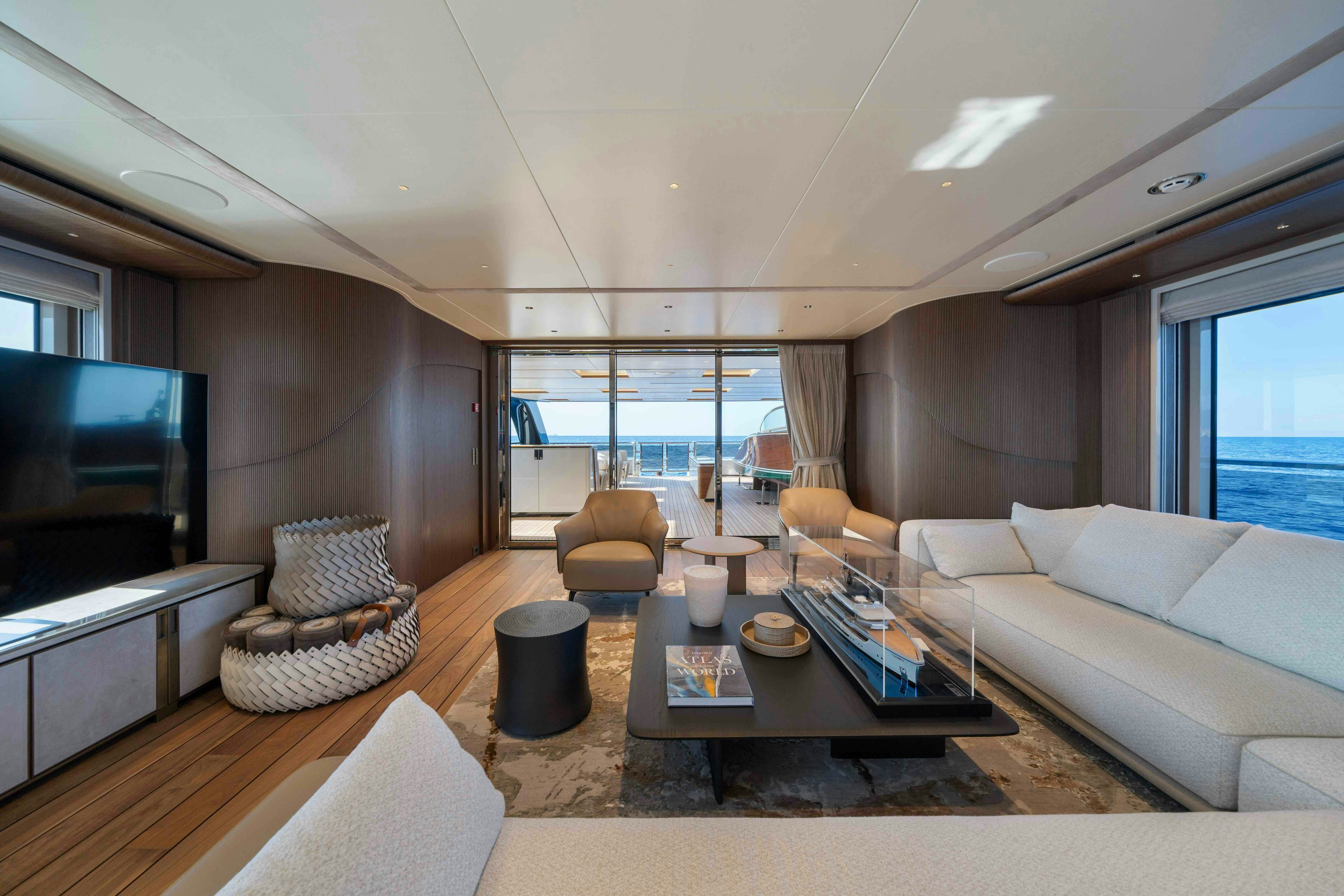 a living room with a large window aboard SERENISSIMA I Yacht for Sale