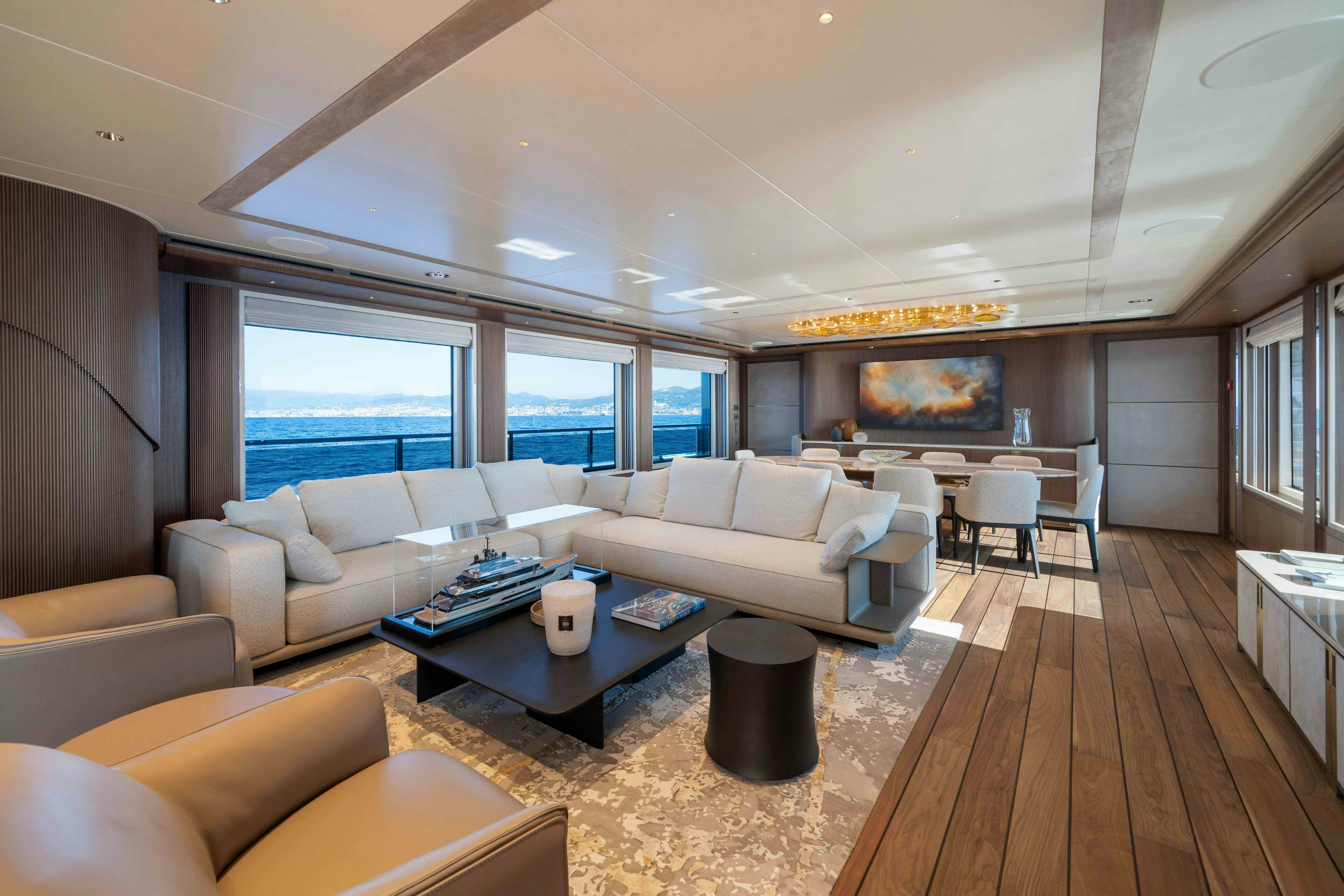 a living room with a wood floor aboard SERENISSIMA I Yacht for Sale