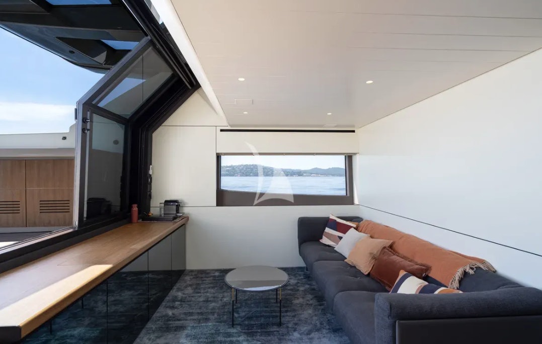 a living room with a couch and a table aboard CC Yacht for Charter
