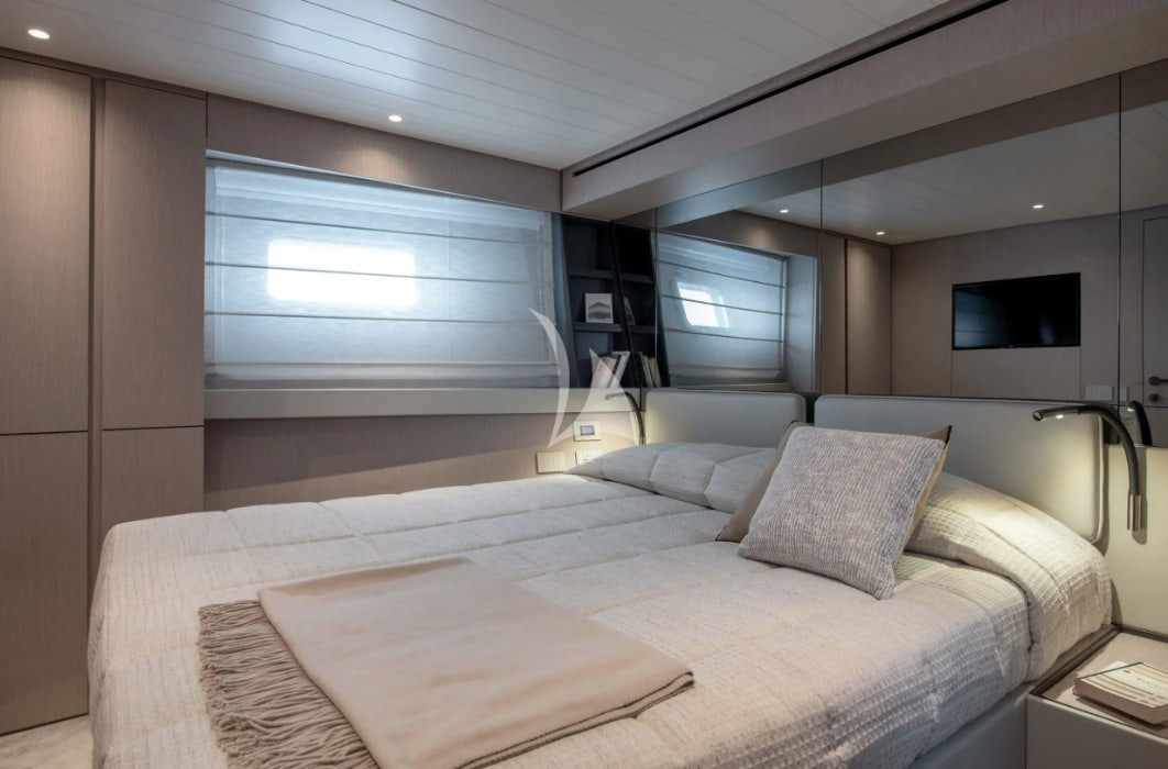 a bed in a room aboard CC Yacht for Charter
