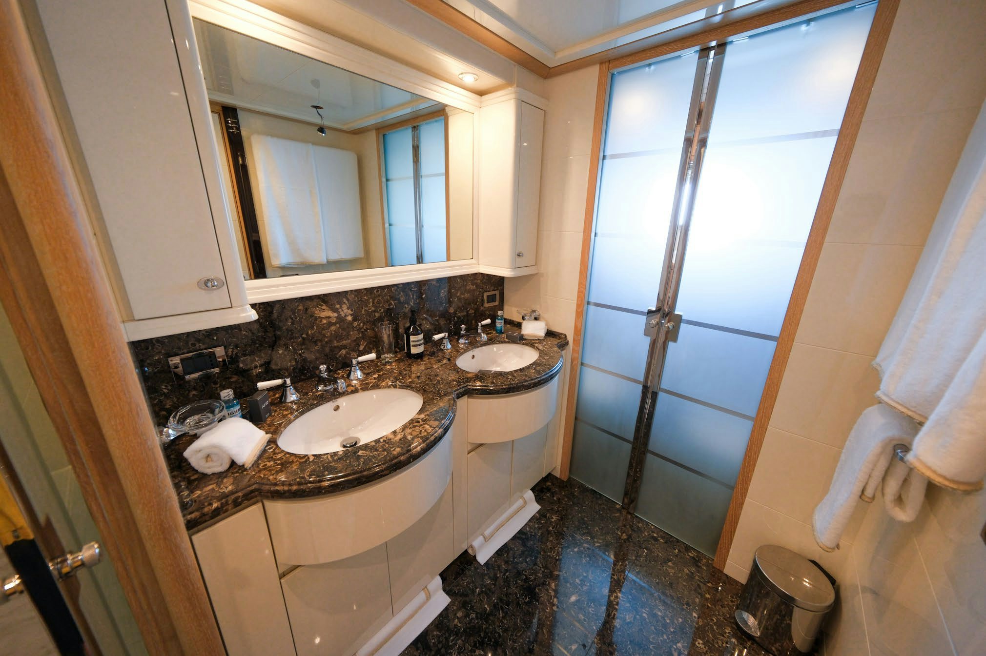a bathroom with a sink and a mirror aboard AERO Yacht for Charter