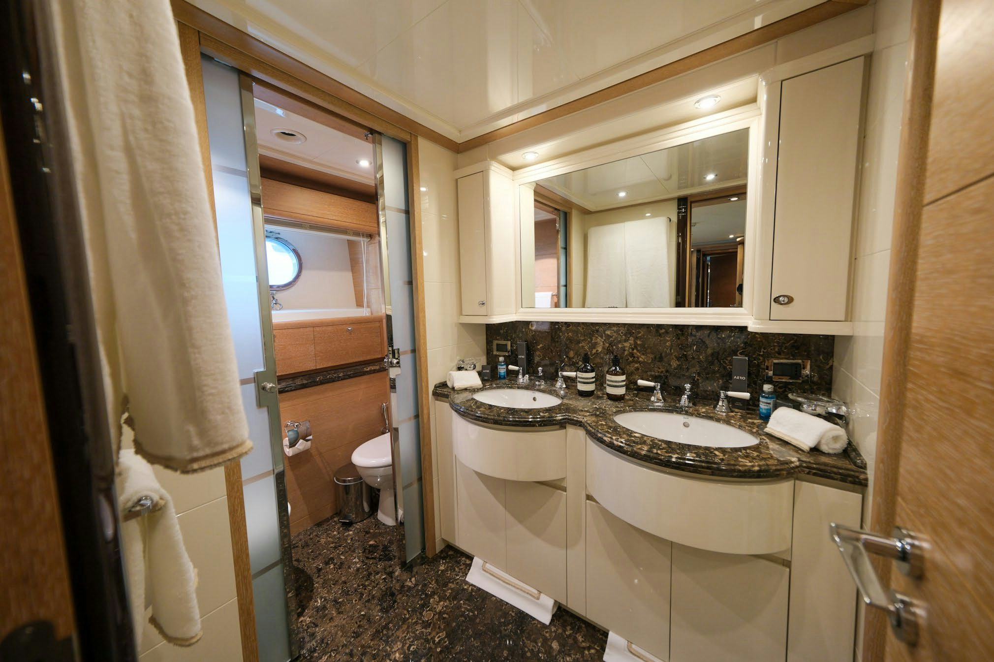 a bathroom with a sink and a mirror aboard AERO Yacht for Charter