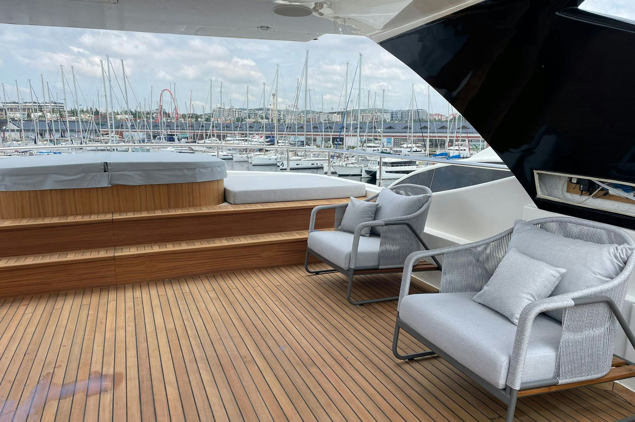 a deck with a view of a city and water aboard AERO Yacht for Charter