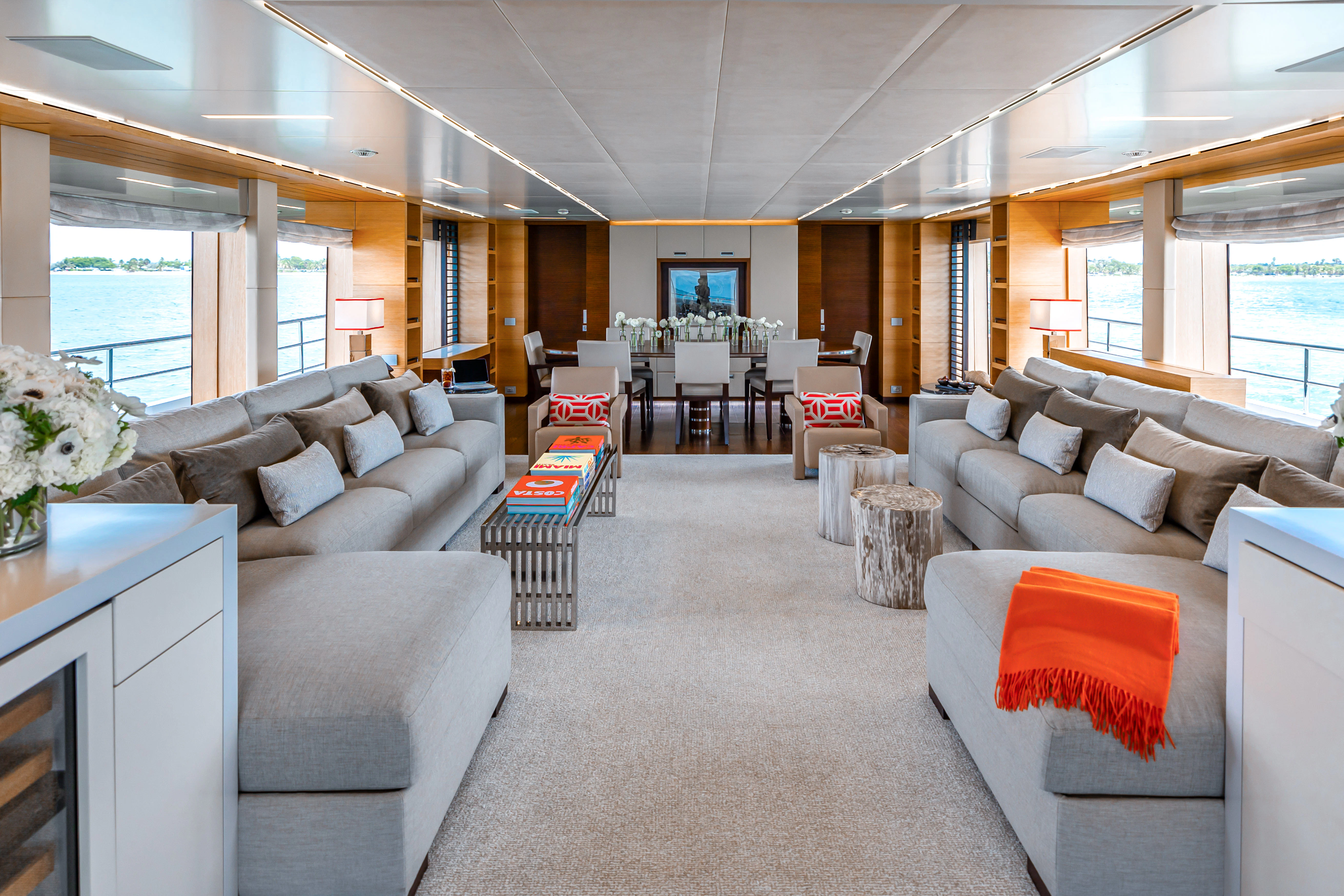 a living room with a large window aboard PATIENCE Yacht for Charter