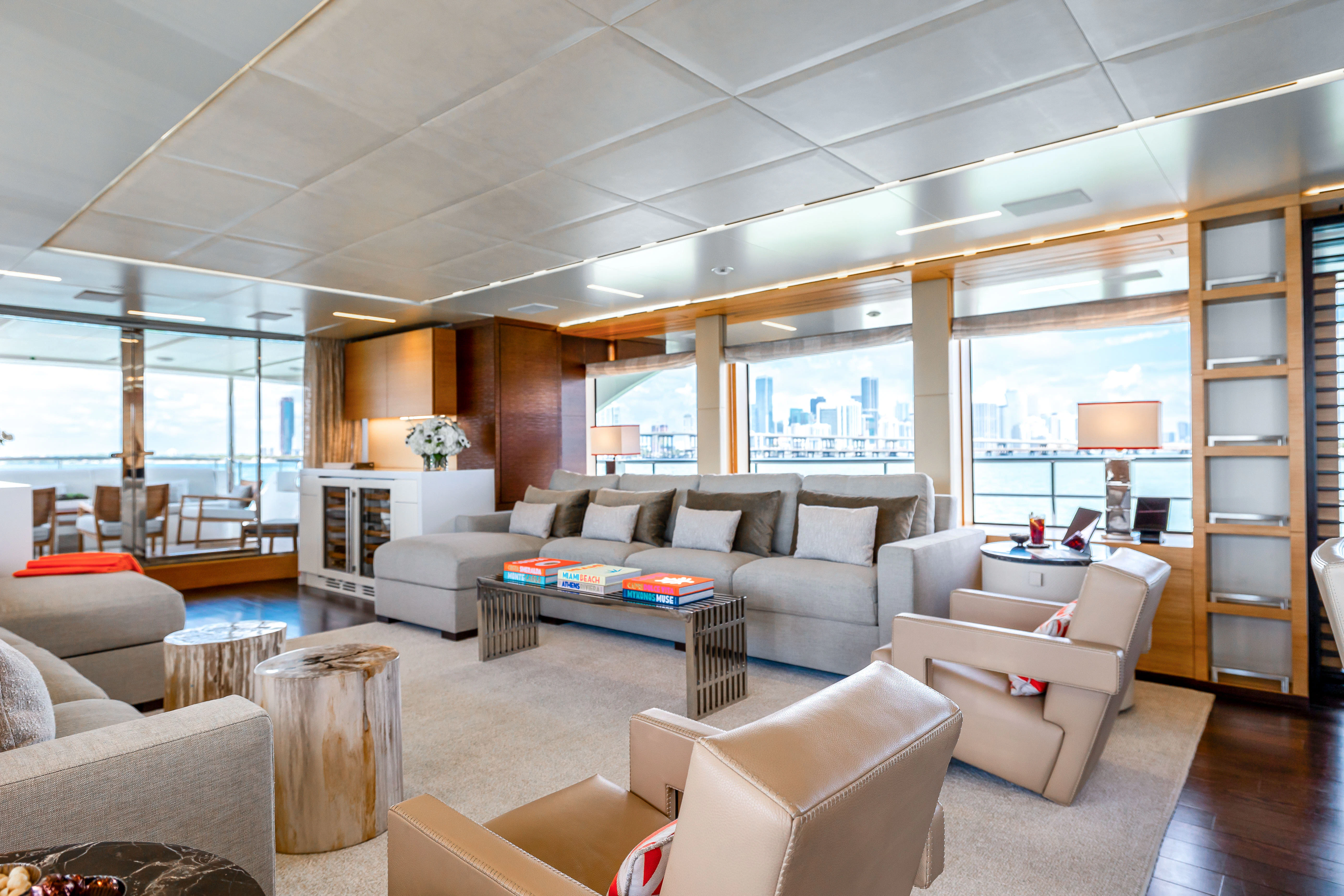 a living room with a large glass window aboard PATIENCE Yacht for Charter