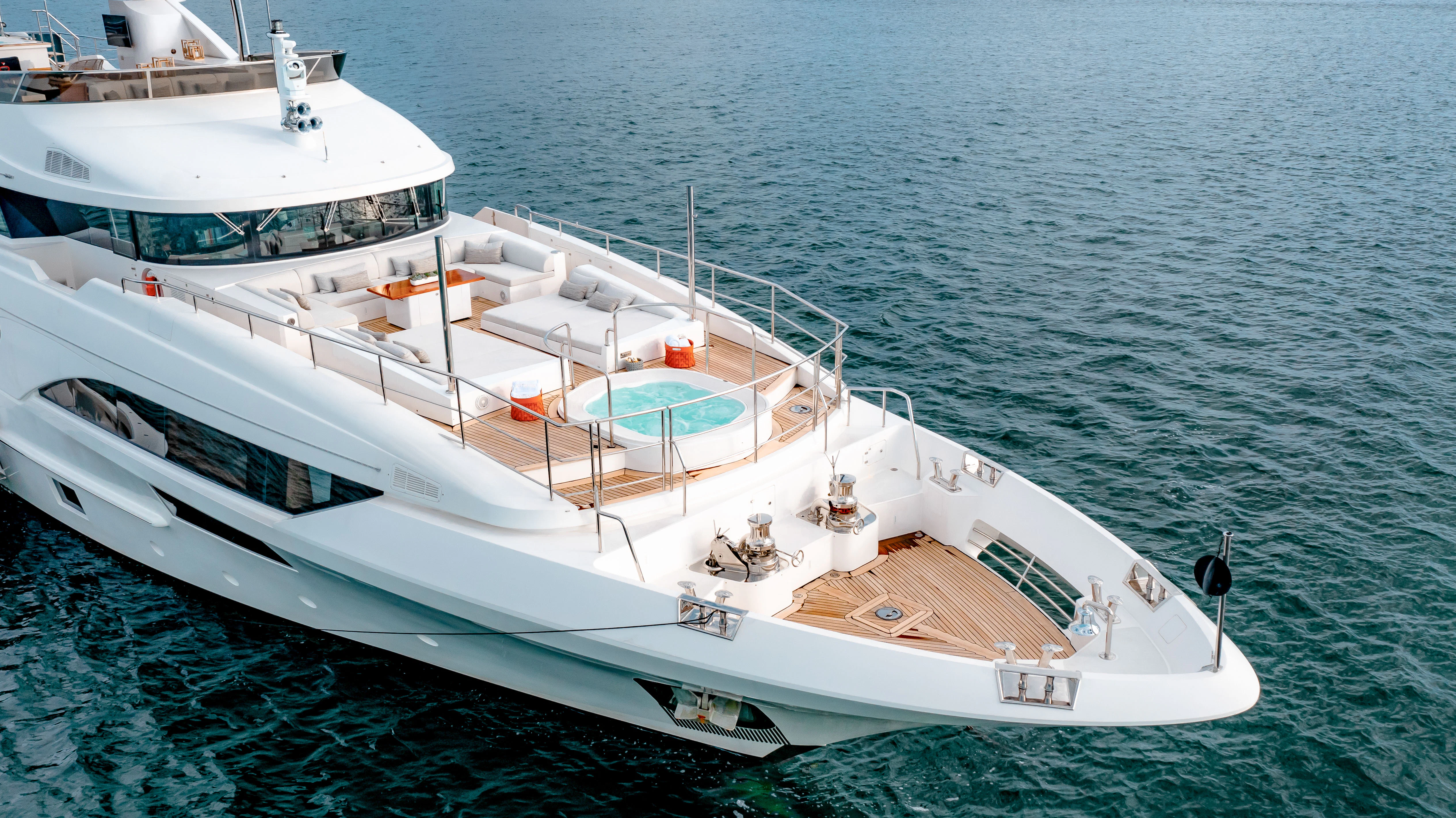 a couple of large white boats in the water aboard PATIENCE Yacht for Charter