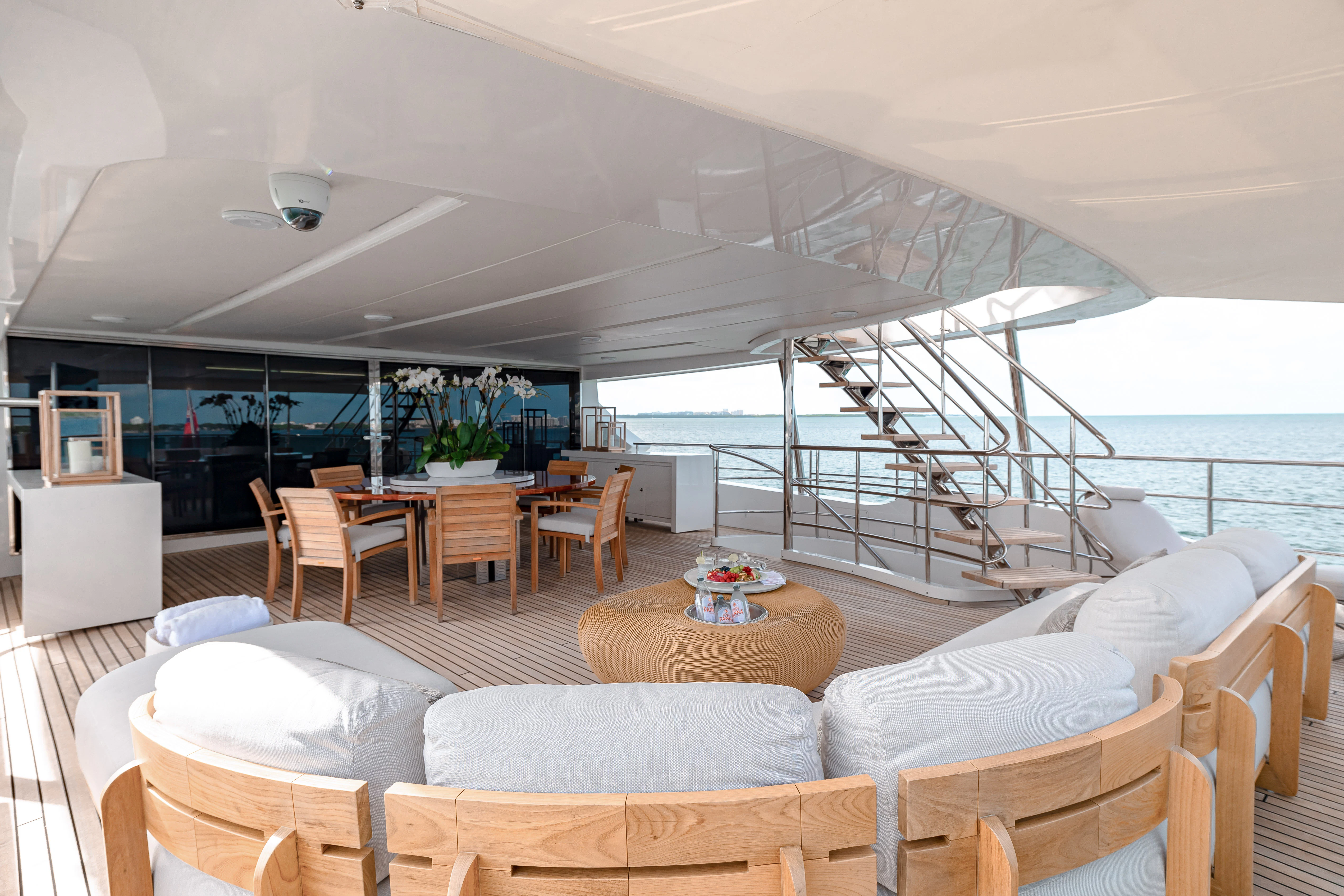 a living room with a large balcony aboard PATIENCE Yacht for Charter