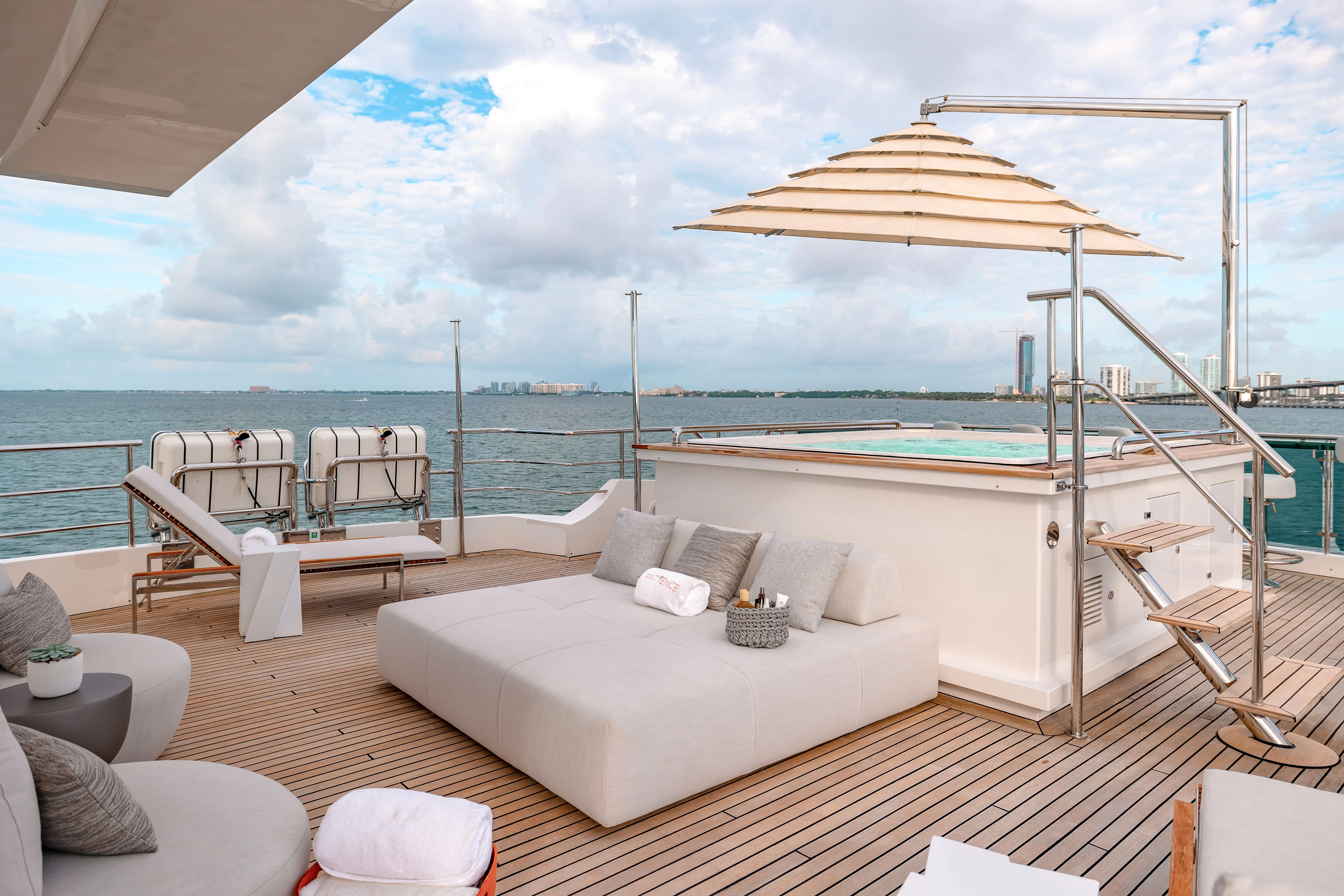 a large white bed on a deck aboard PATIENCE Yacht for Charter