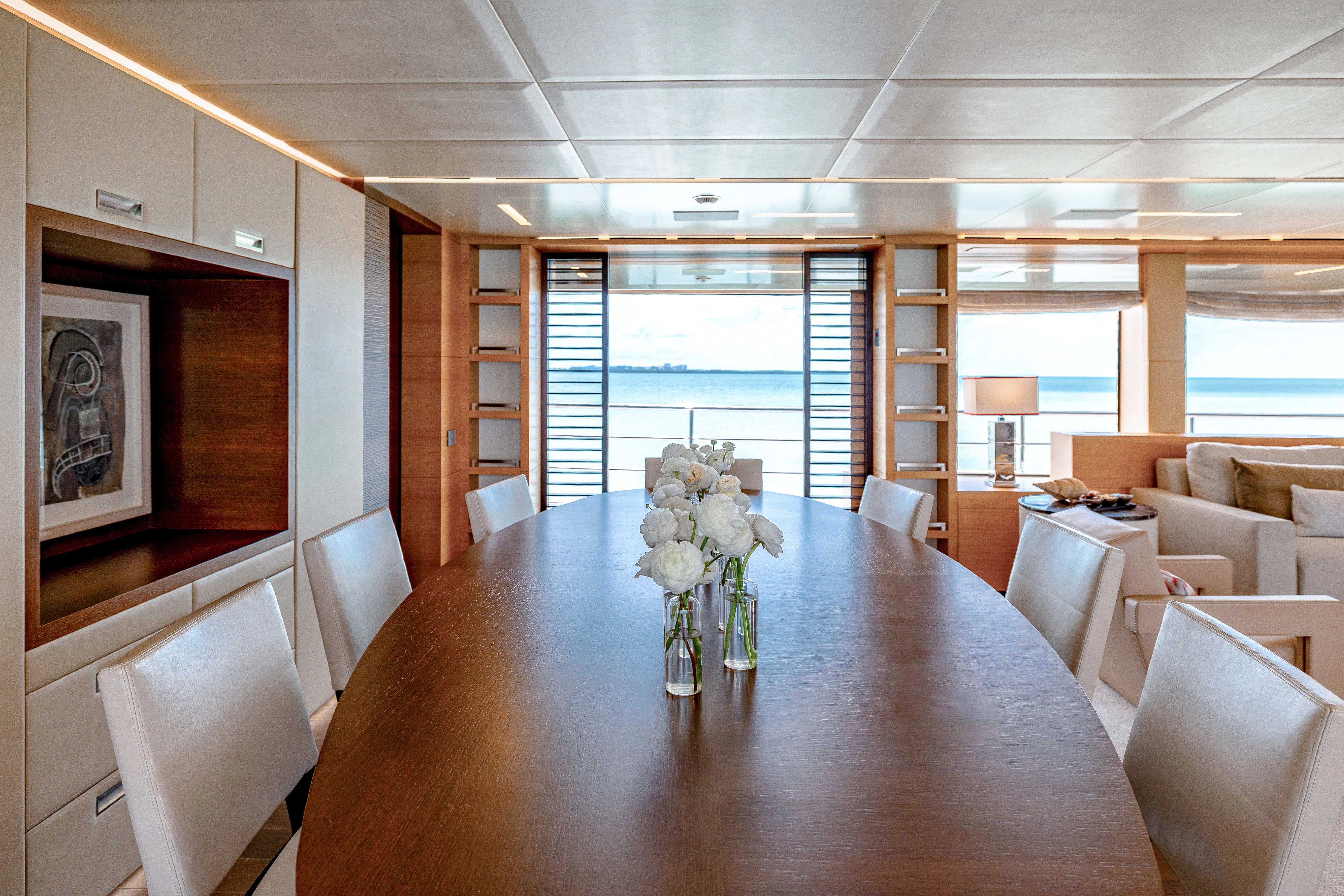 a large room with a table and chairs aboard PATIENCE Yacht for Charter