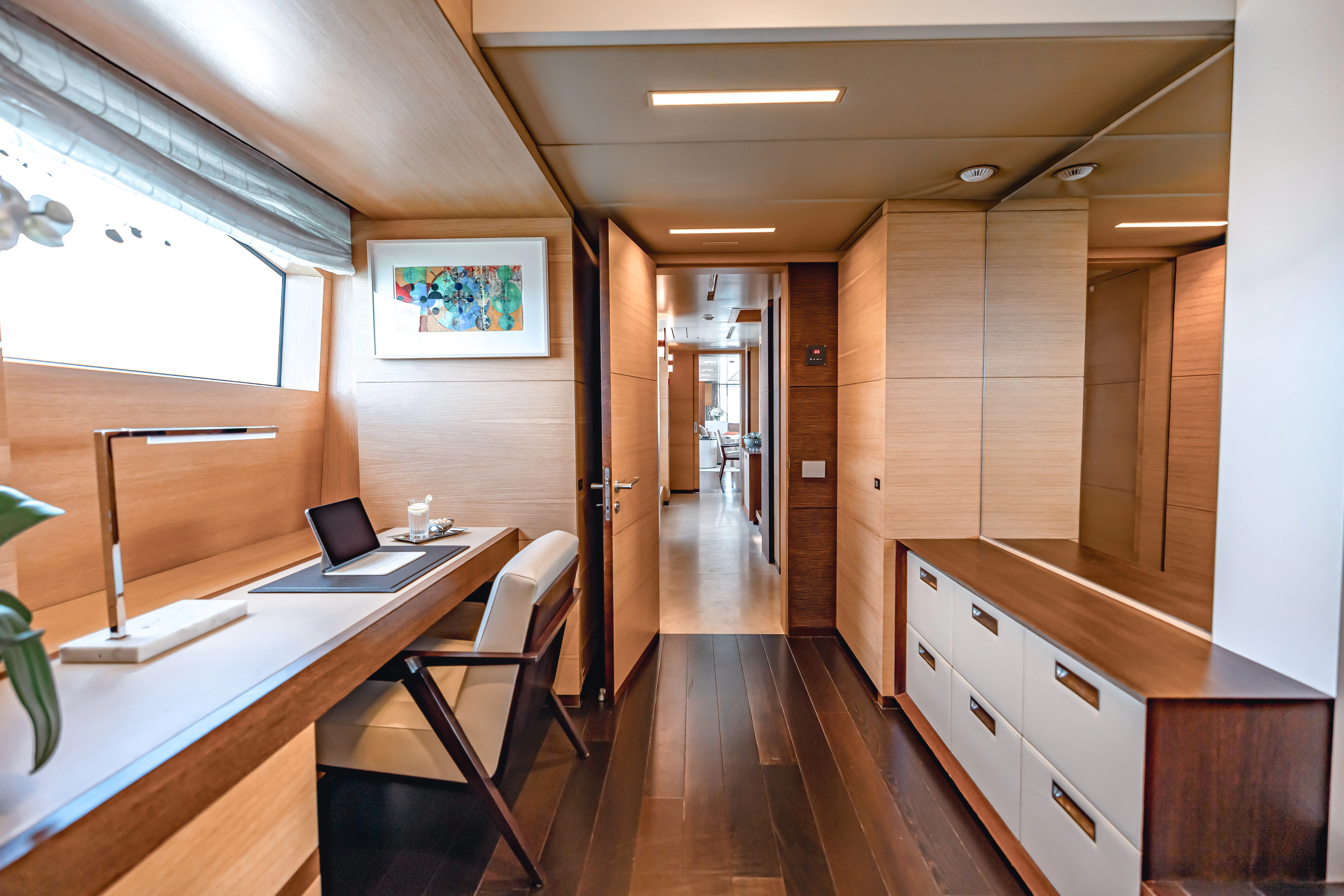 a room with a desk and a laptop aboard PATIENCE Yacht for Charter