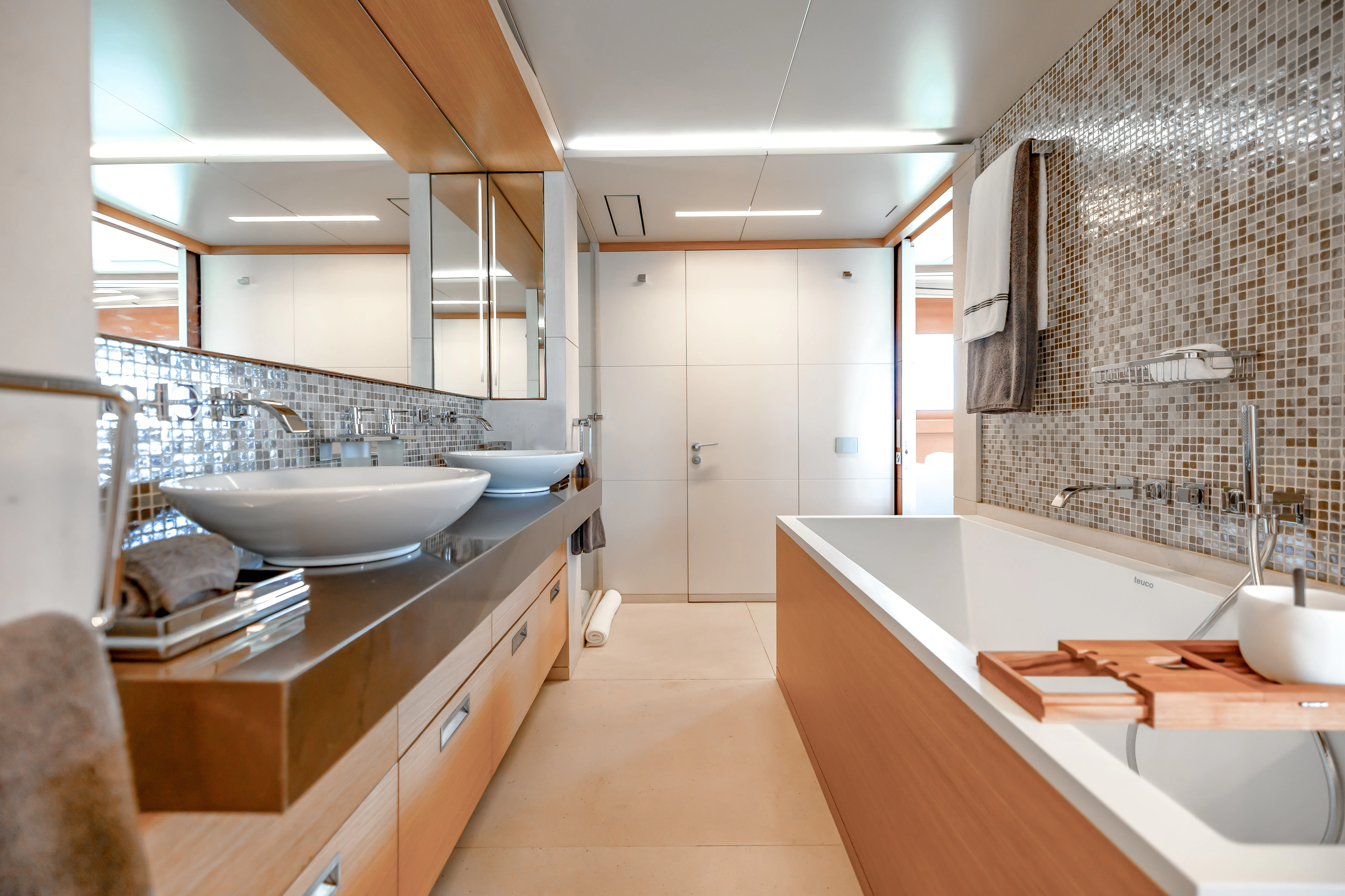 a bathroom with a sink and a bathtub aboard PATIENCE Yacht for Charter