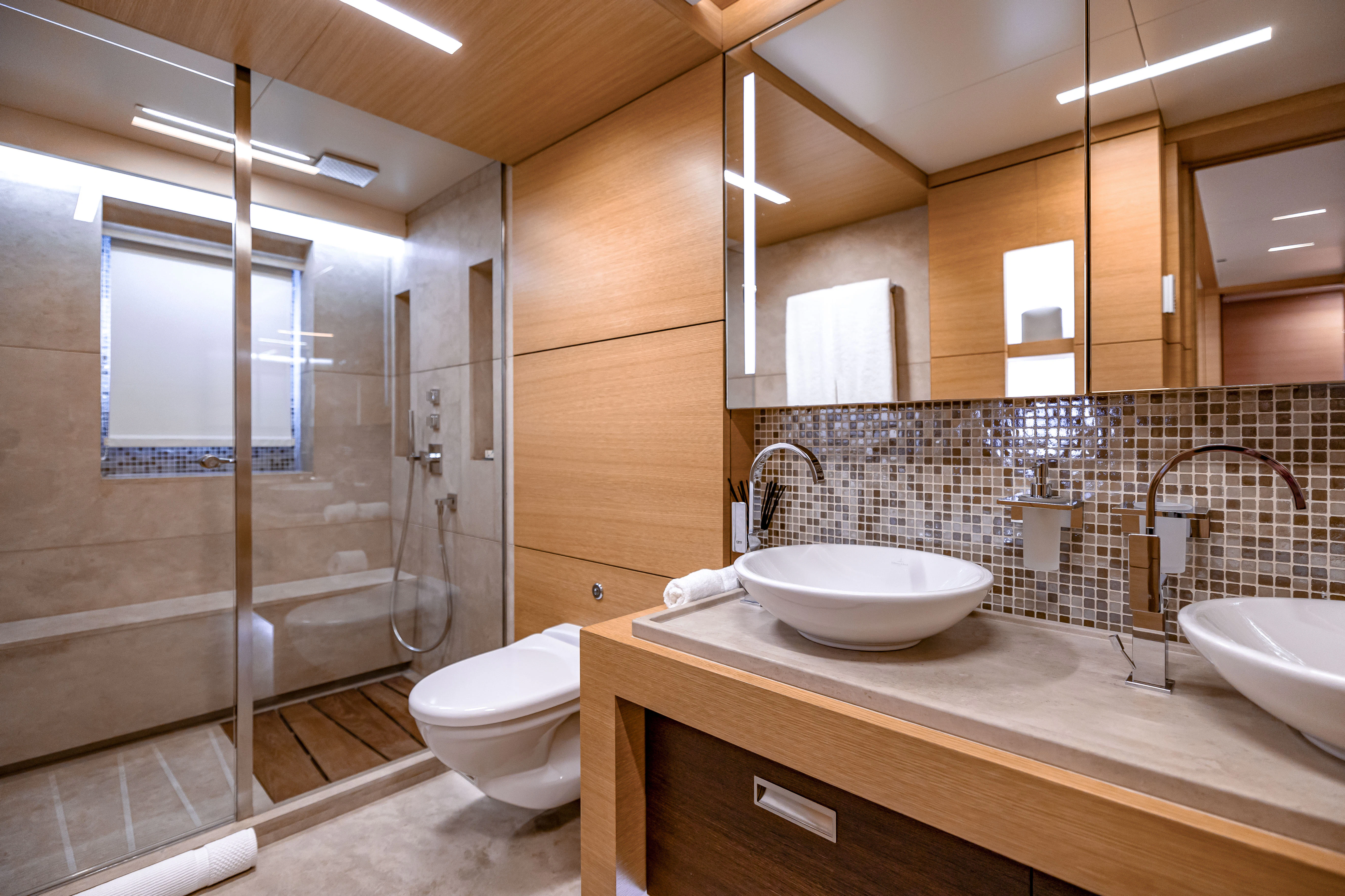 a bathroom with a sink and a toilet aboard PATIENCE Yacht for Charter