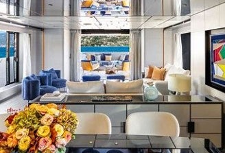 a room with a table and chairs aboard FELICITY Yacht for Charter