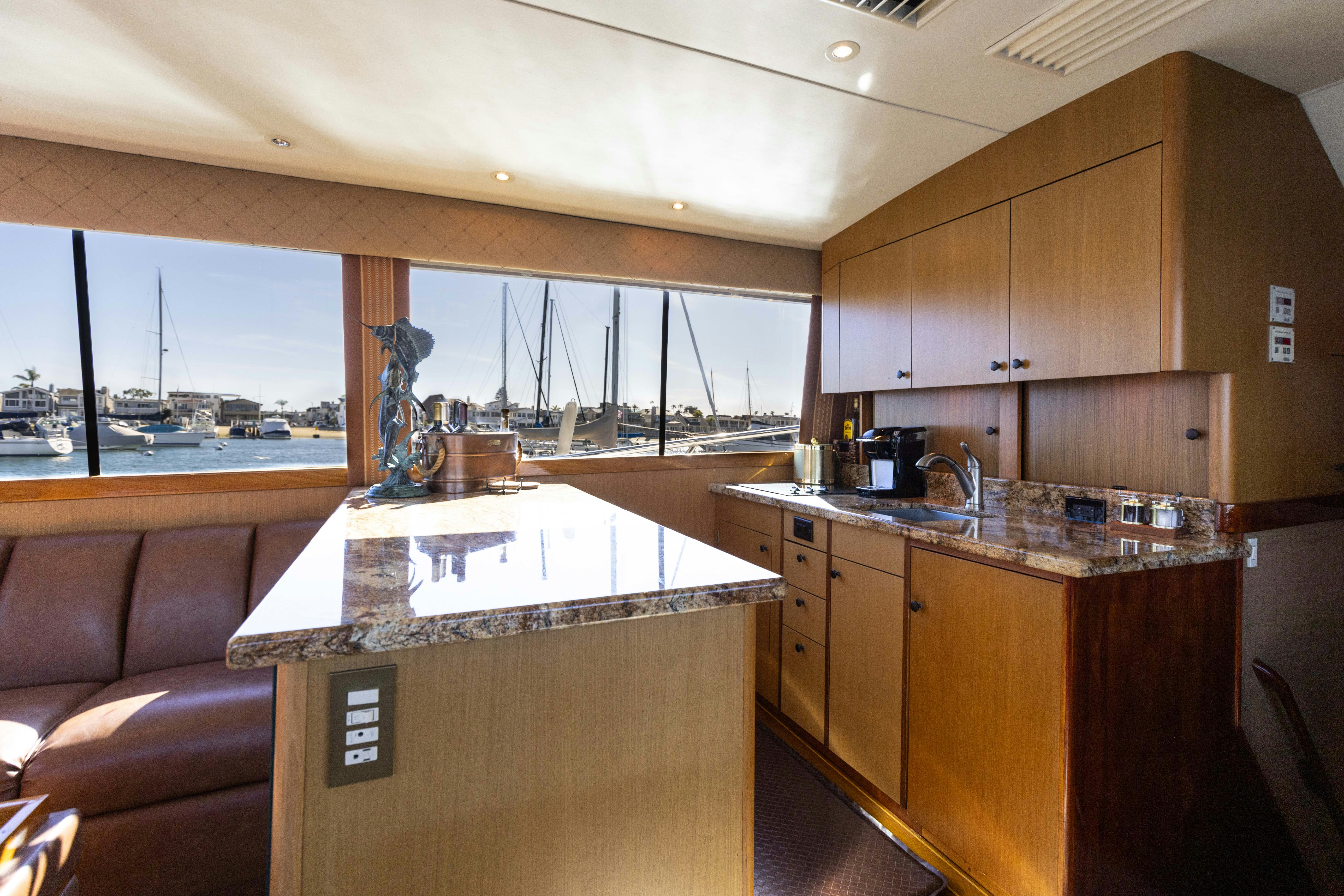 a kitchen with a large island aboard LUCKY MARLIN Yacht for Sale