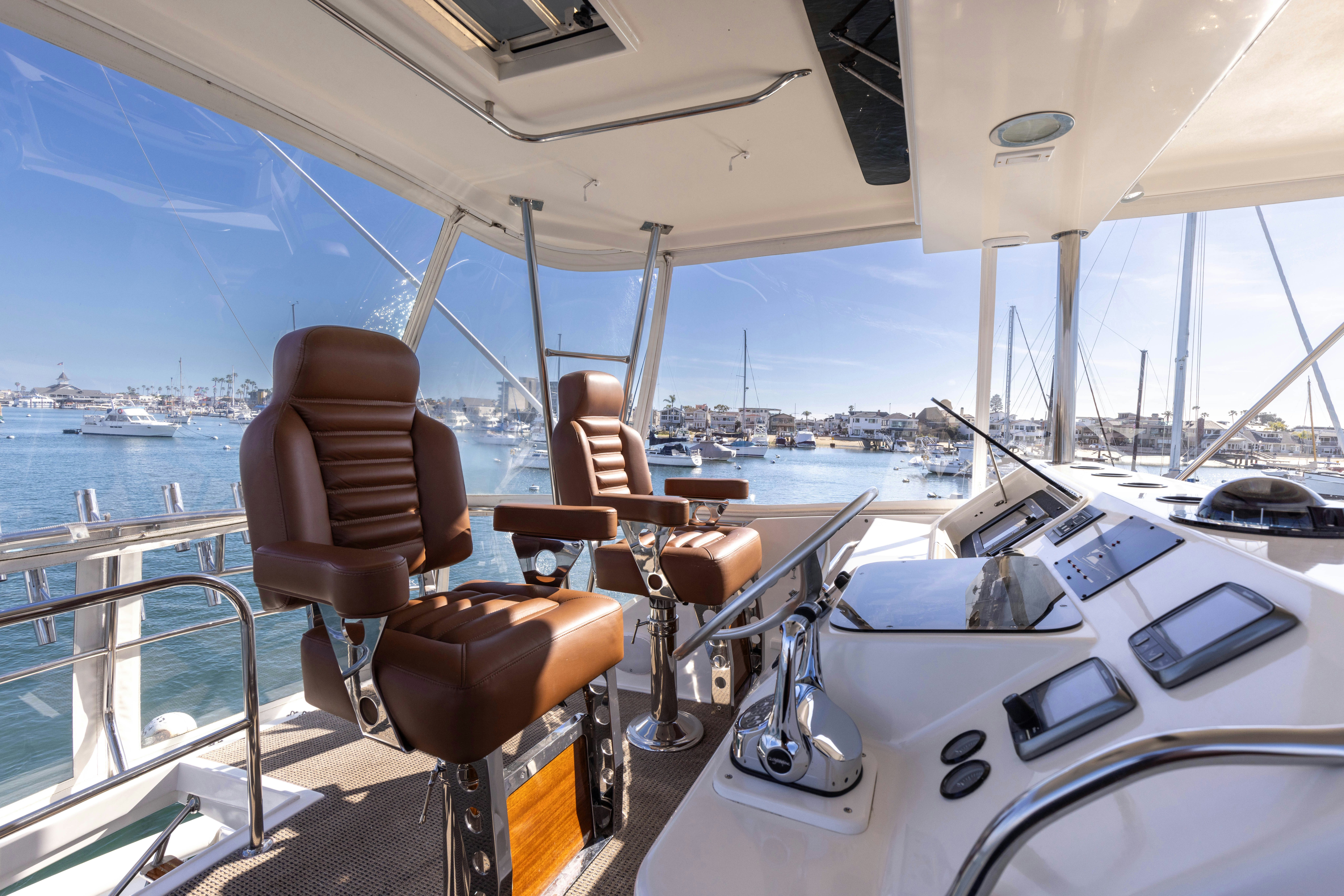 a boat with chairs on it aboard LUCKY MARLIN Yacht for Sale
