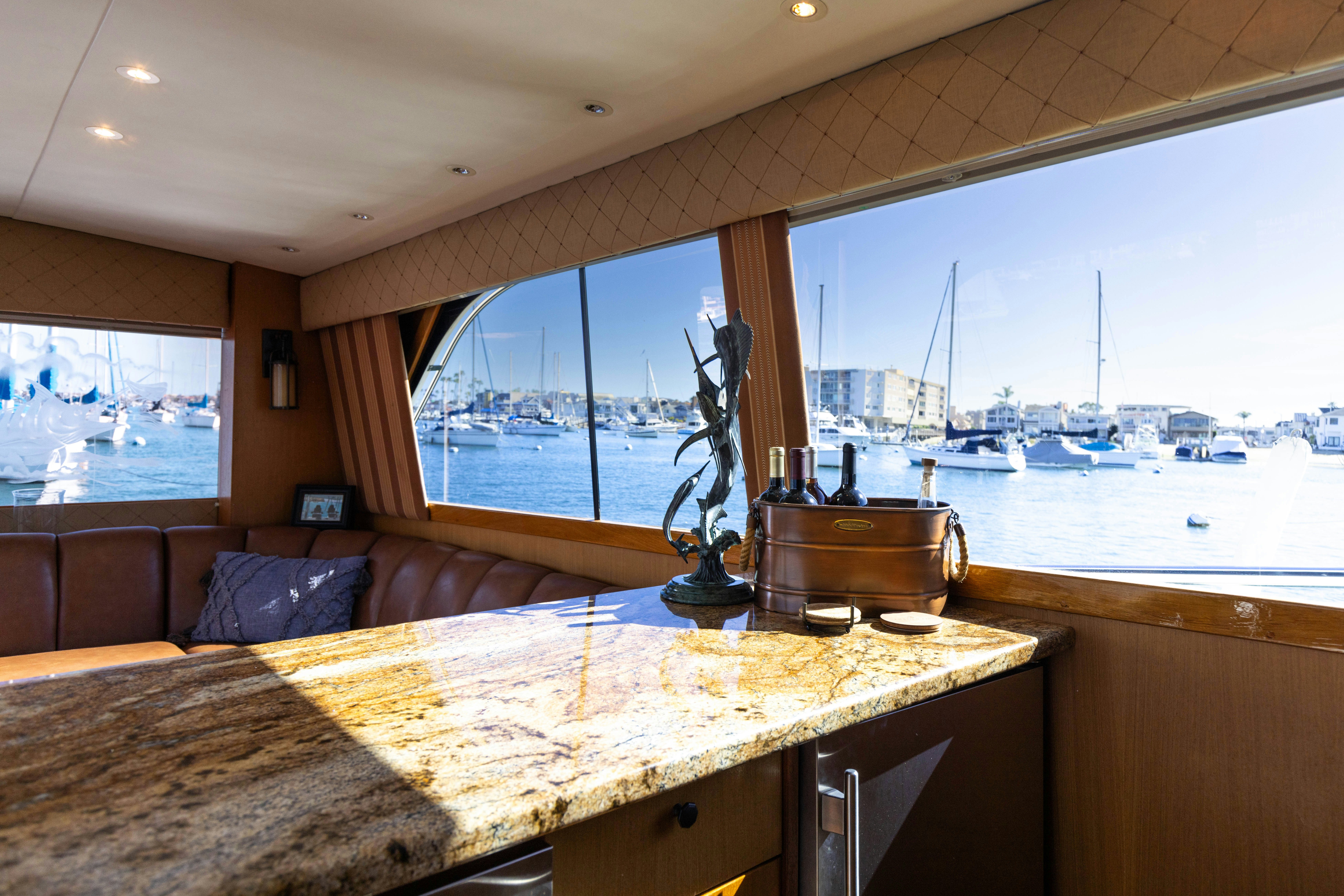 a kitchen with a large window overlooking a body of water aboard LUCKY MARLIN Yacht for Sale