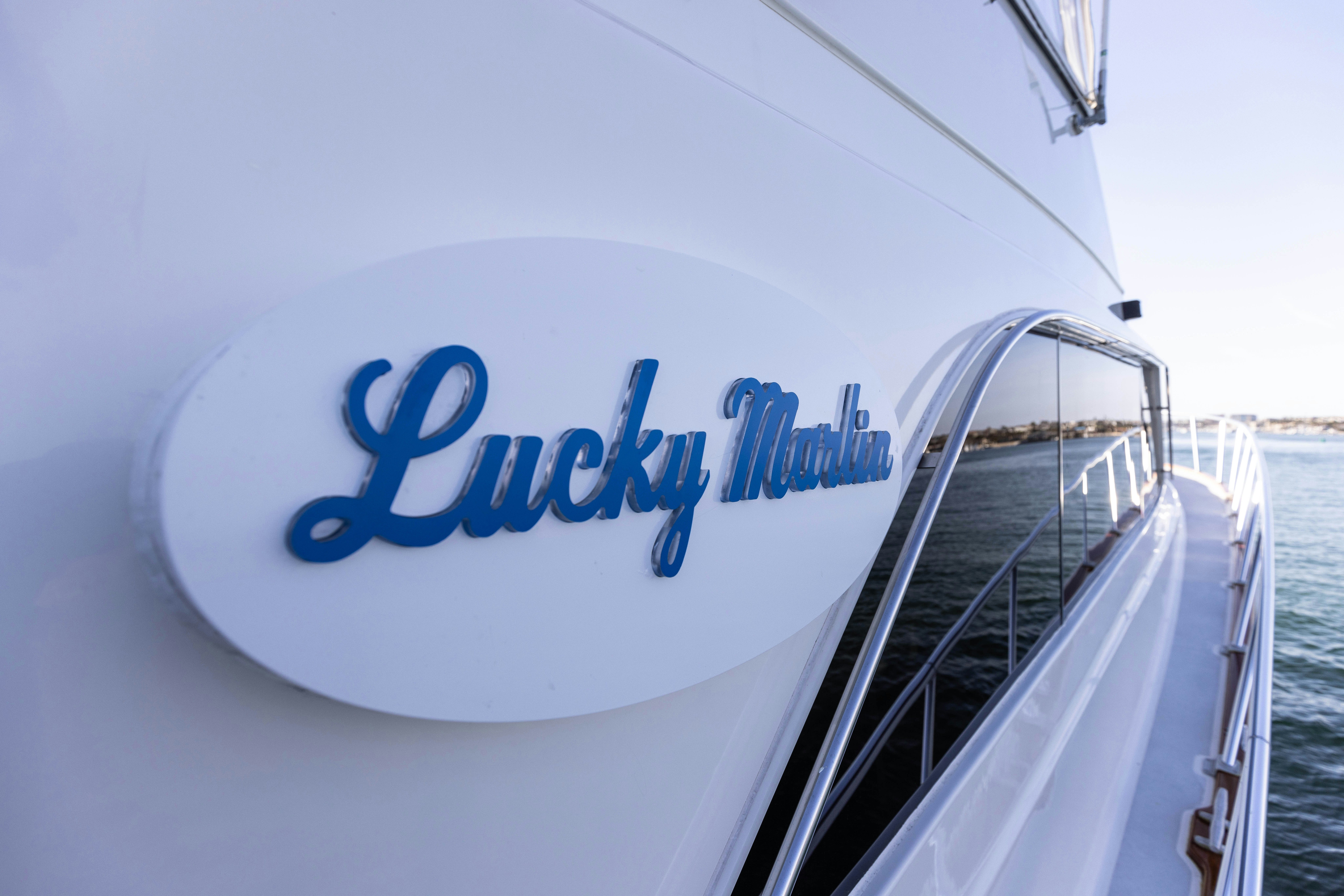 a white sign on a boat aboard LUCKY MARLIN Yacht for Sale