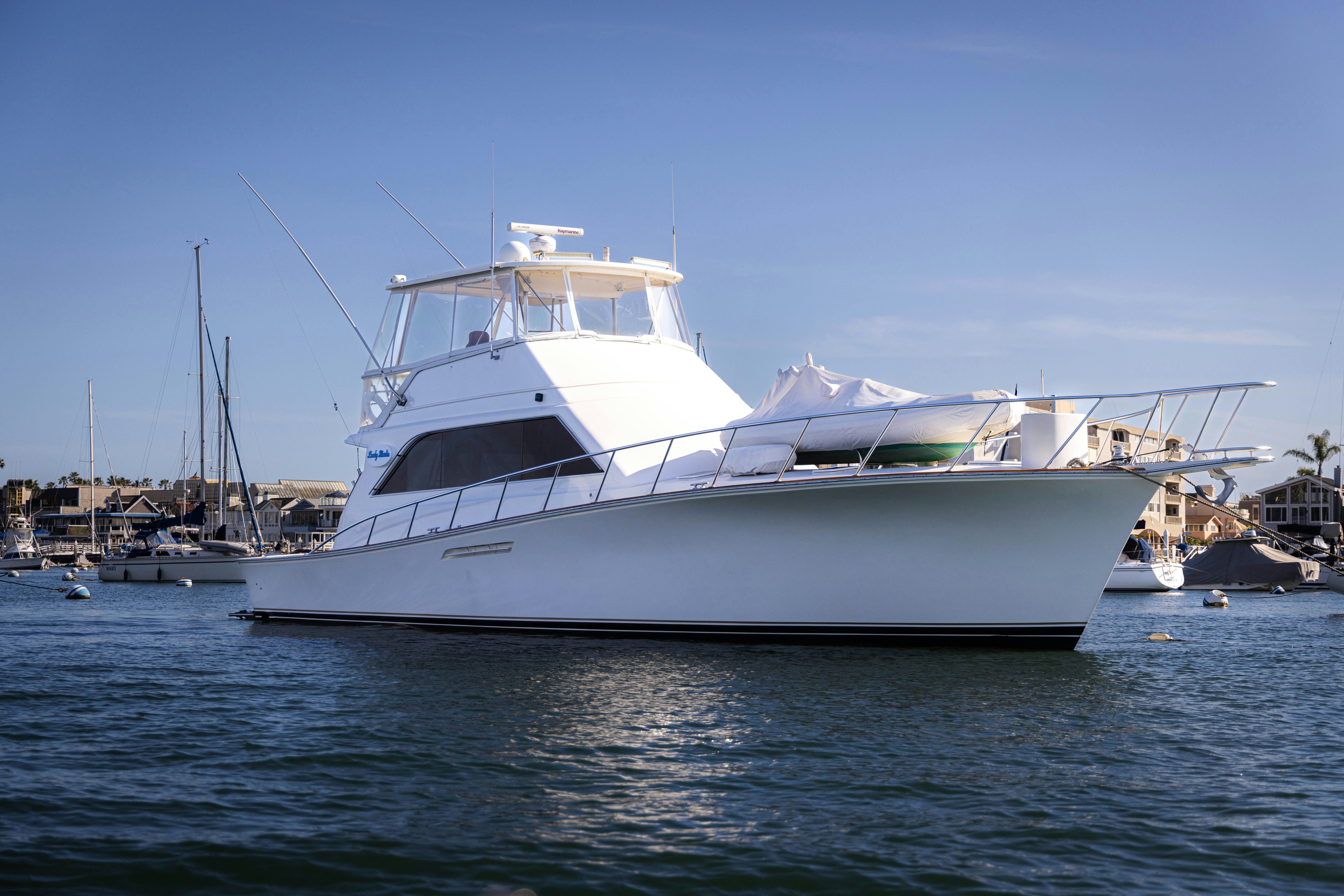 a white yacht in the water aboard LUCKY MARLIN Yacht for Sale