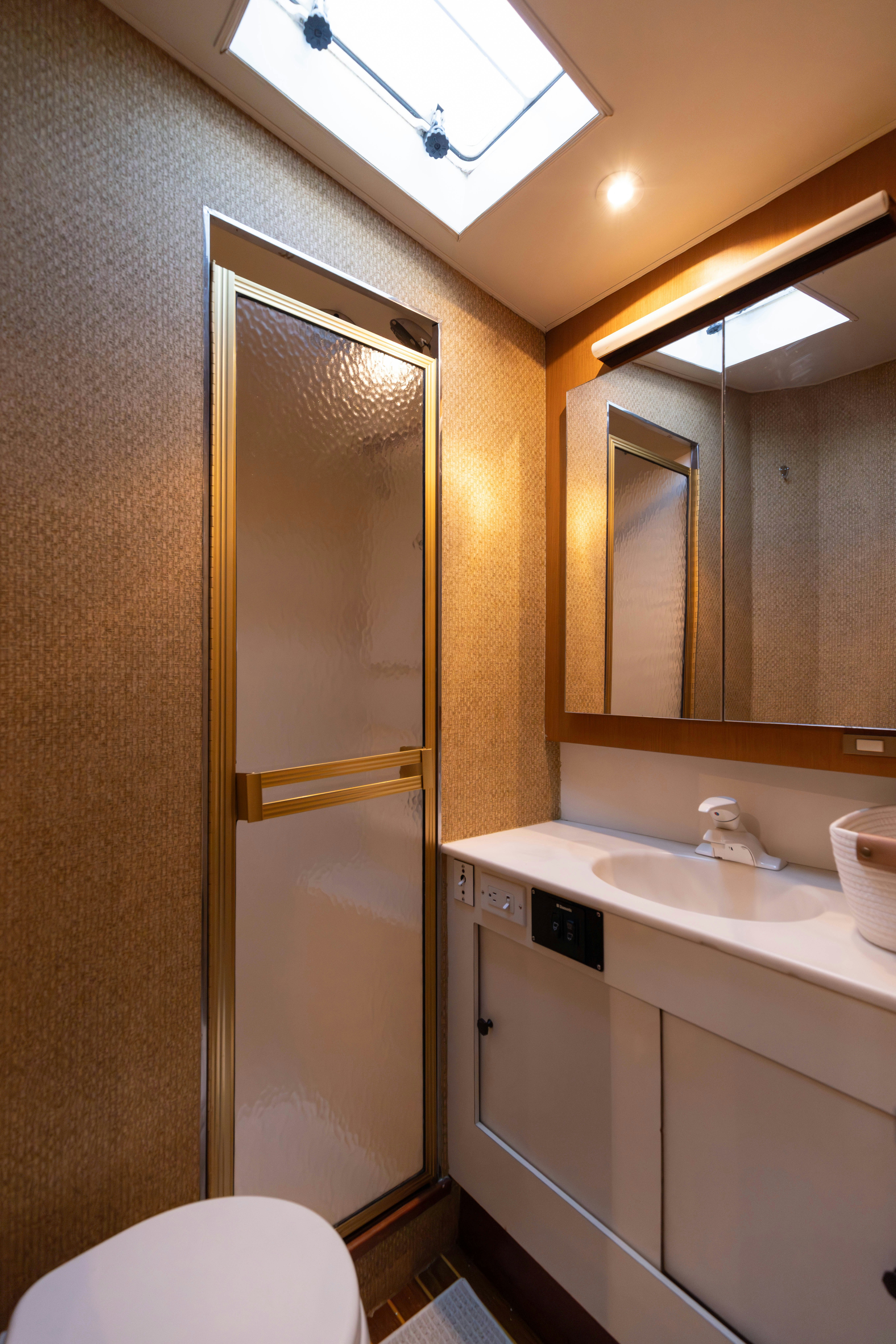 a bathroom with a large mirror aboard LUCKY MARLIN Yacht for Sale