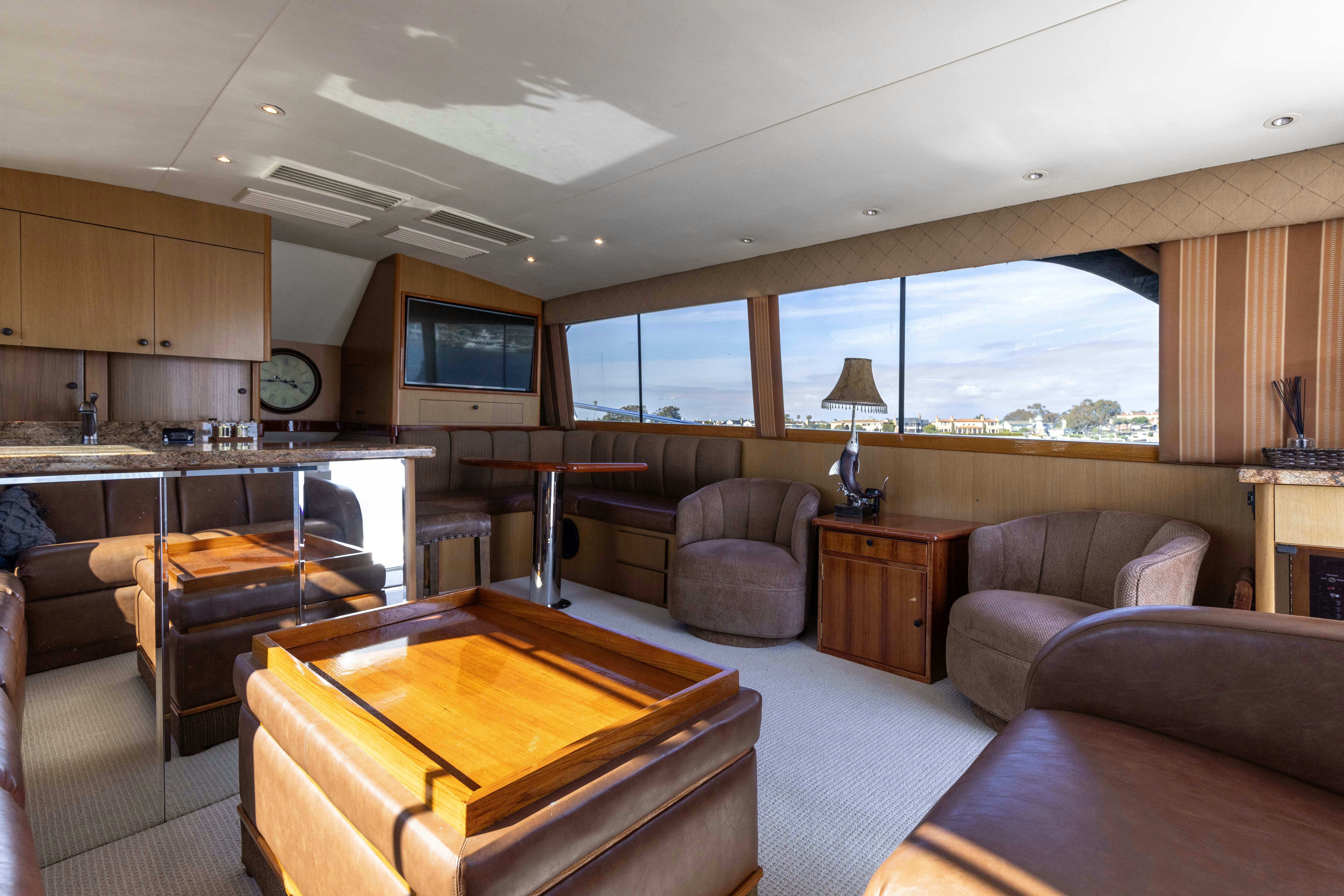 a living room with a piano aboard LUCKY MARLIN Yacht for Sale