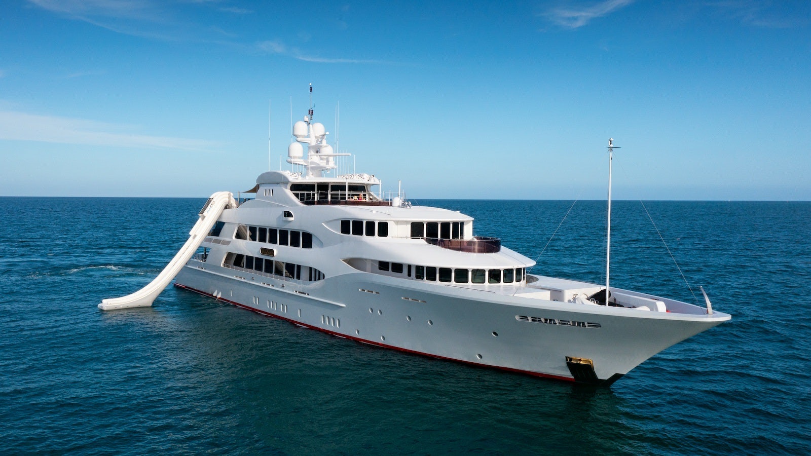 a large white boat in the water aboard IRON BLONDE Yacht for Charter