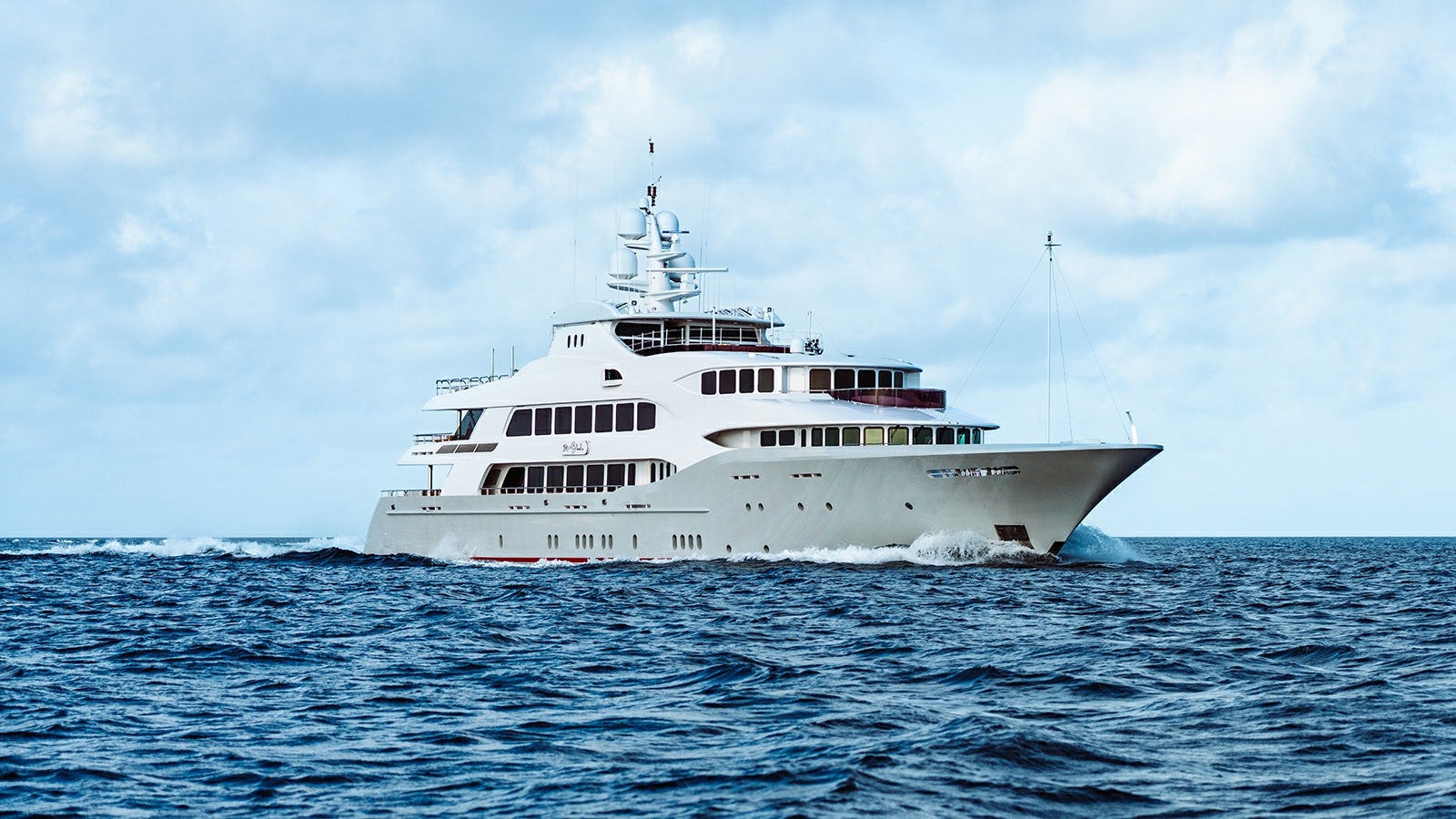 a large white boat in the water aboard IRON BLONDE Yacht for Charter