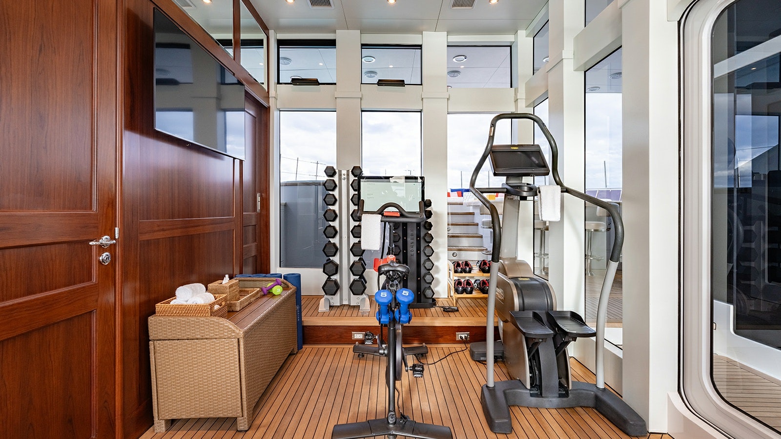 a room with a large mirror and a bench aboard IRON BLONDE Yacht for Charter