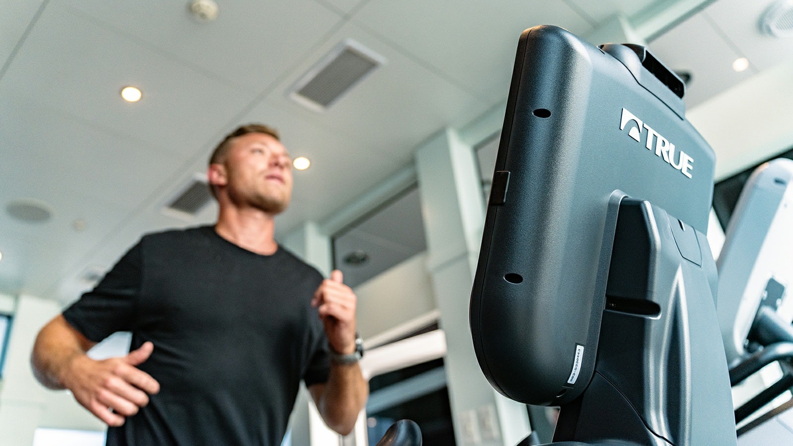a man standing next to a machine aboard IRON BLONDE Yacht for Charter