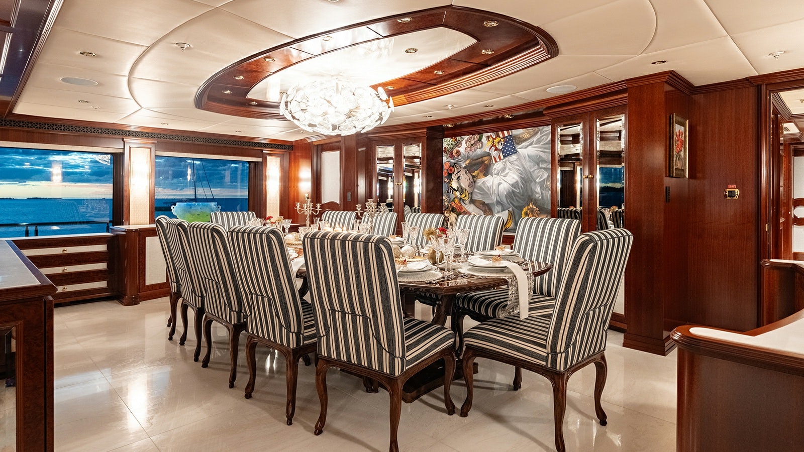 a dining room with a table and chairs aboard IRON BLONDE Yacht for Charter
