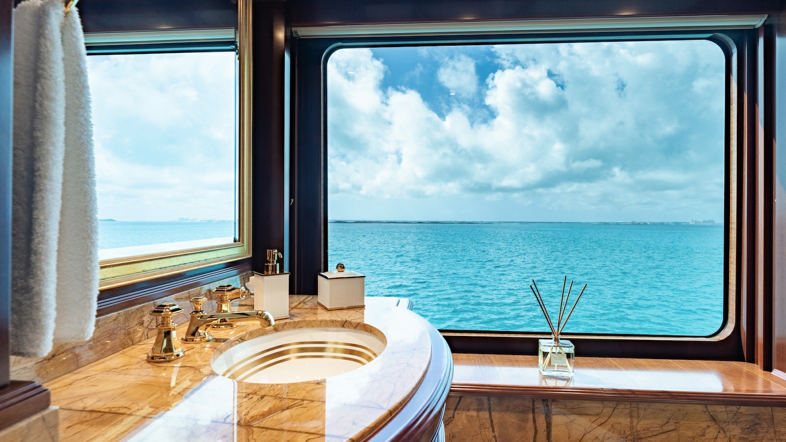 a bathroom with a large window aboard IRON BLONDE Yacht for Charter