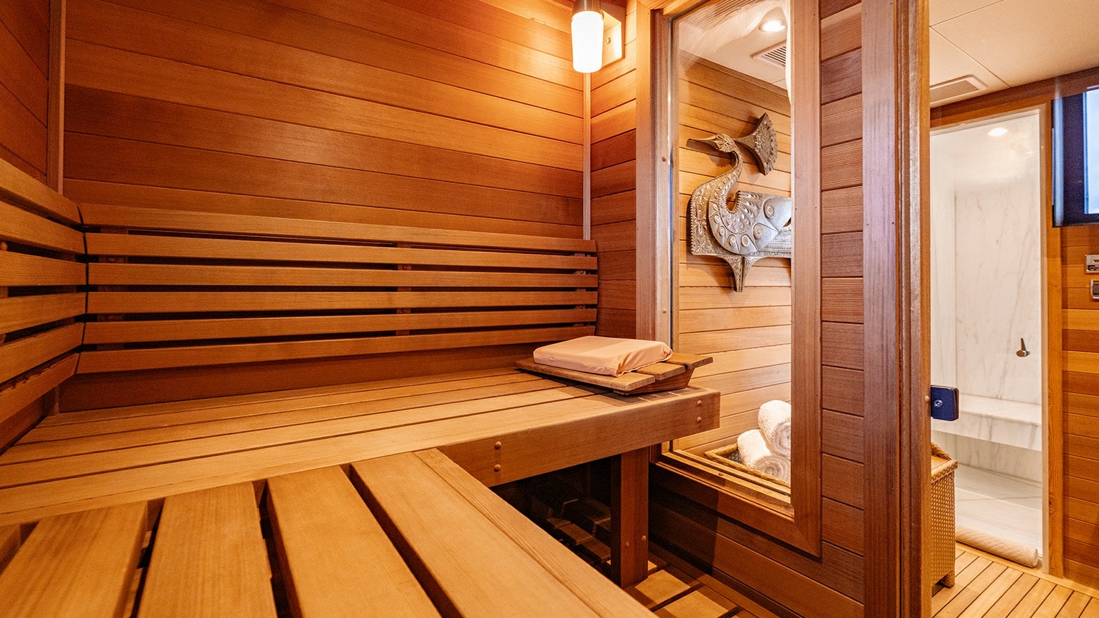 a room with a bed and a mirror aboard IRON BLONDE Yacht for Charter