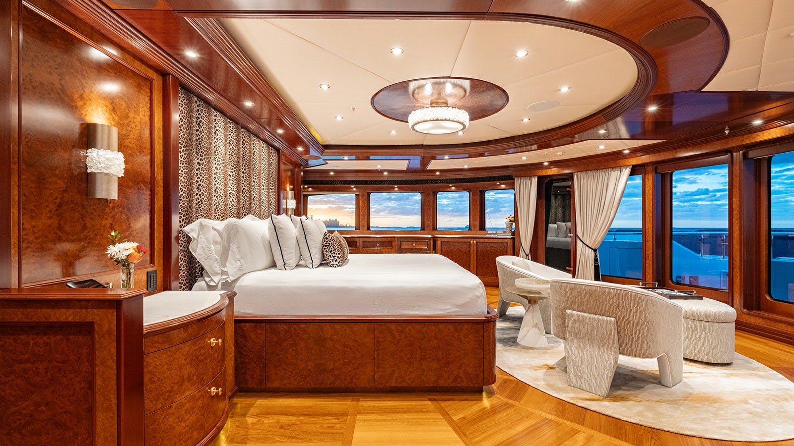 a room with a bed and a desk aboard IRON BLONDE Yacht for Charter